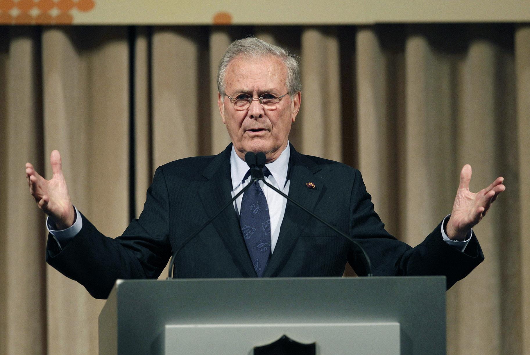 In this Oct. 11, 2011, file photo, former U.S. Secretary of Defense Donald Rumsfeld speaks to politicians and academics during a luncheon on security in rising Asia, in Taipei, Taiwan. The family of Rumsfeld says he has died. He was 88. (AP Photo / Wally Santana, File)