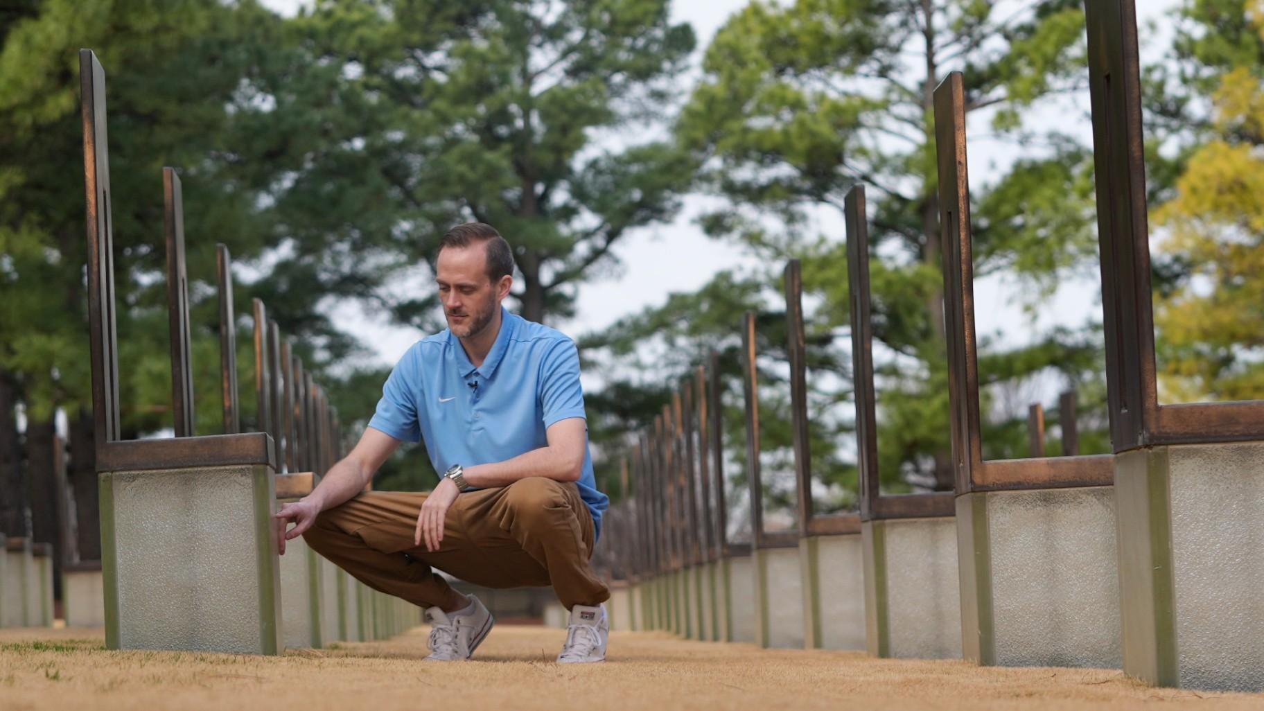 Austin Allen touches a memorial for his deceased father, Ted Allen, in the Field of Empty Chairs section of the Oklahoma City National Memorial &amp; Museum on March 12, 2025. Austin was 4 years old when his father died in the bombing of the Alfred P. Murrah Federal Building. (AP Photo / LM Otero)