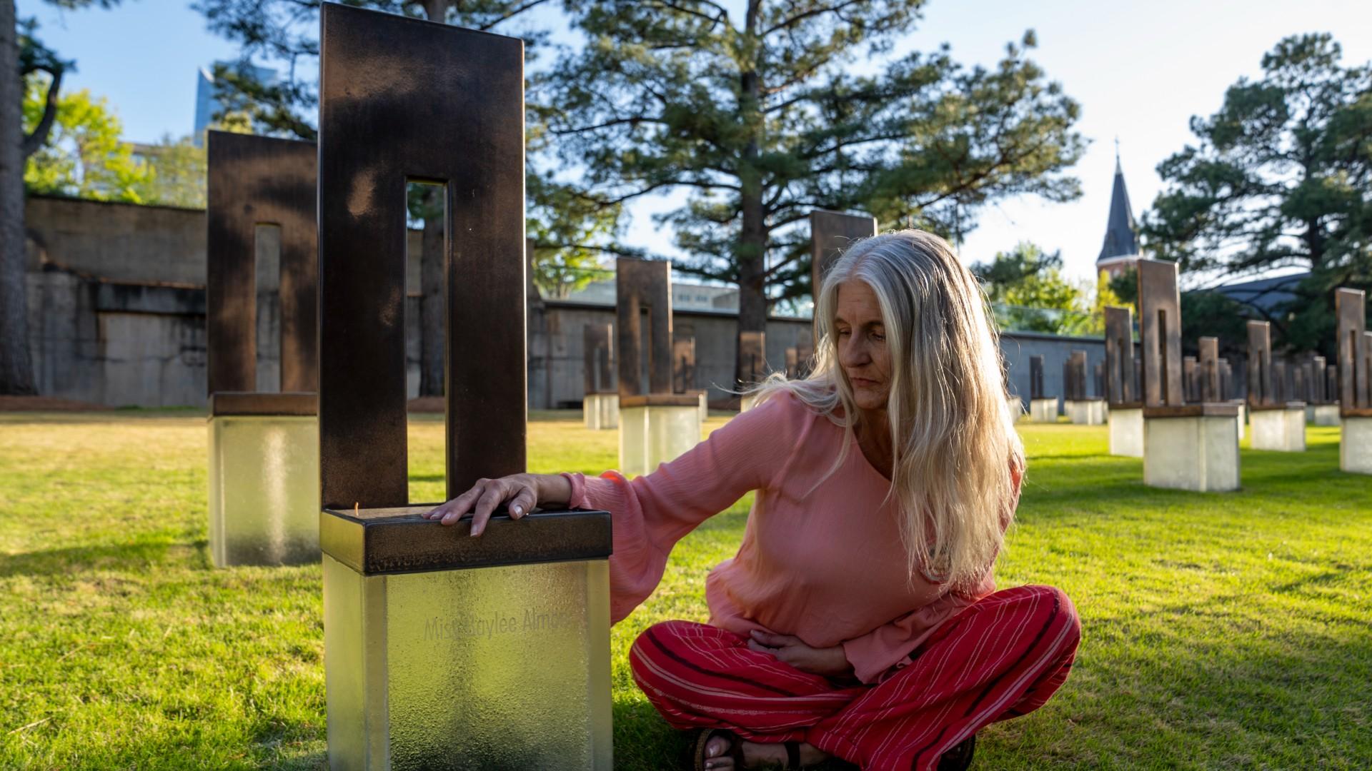 Aren Almon poses for a portrait next to the memorial chair for her daughter, Baylee Almon, at the Oklahoma City National Memorial on Wednesday, April 9, 2025 in Oklahoma City. (AP Photo / Nick Oxford)