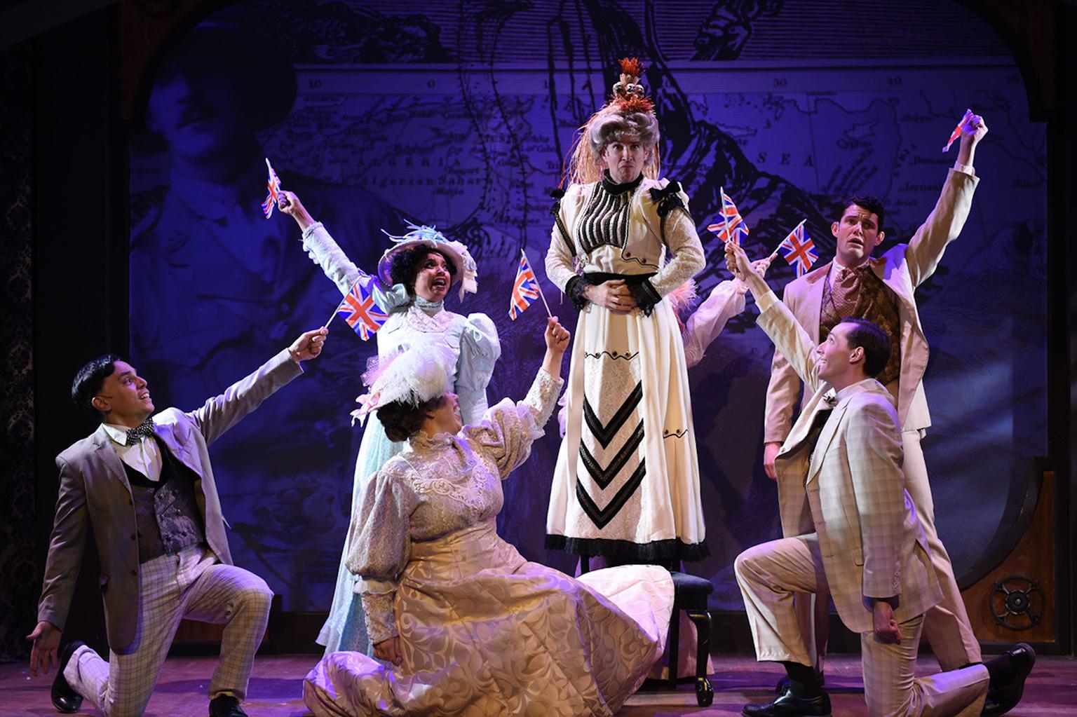 From left: Michael Reyes, Sharriese Hamilton, Megan Elk, Matt Crowle, on chair, Ryan Dooley and Billy Dwyer in “A Gentleman’s Guide to Love & Murder.” (Photo by Michael Courier)