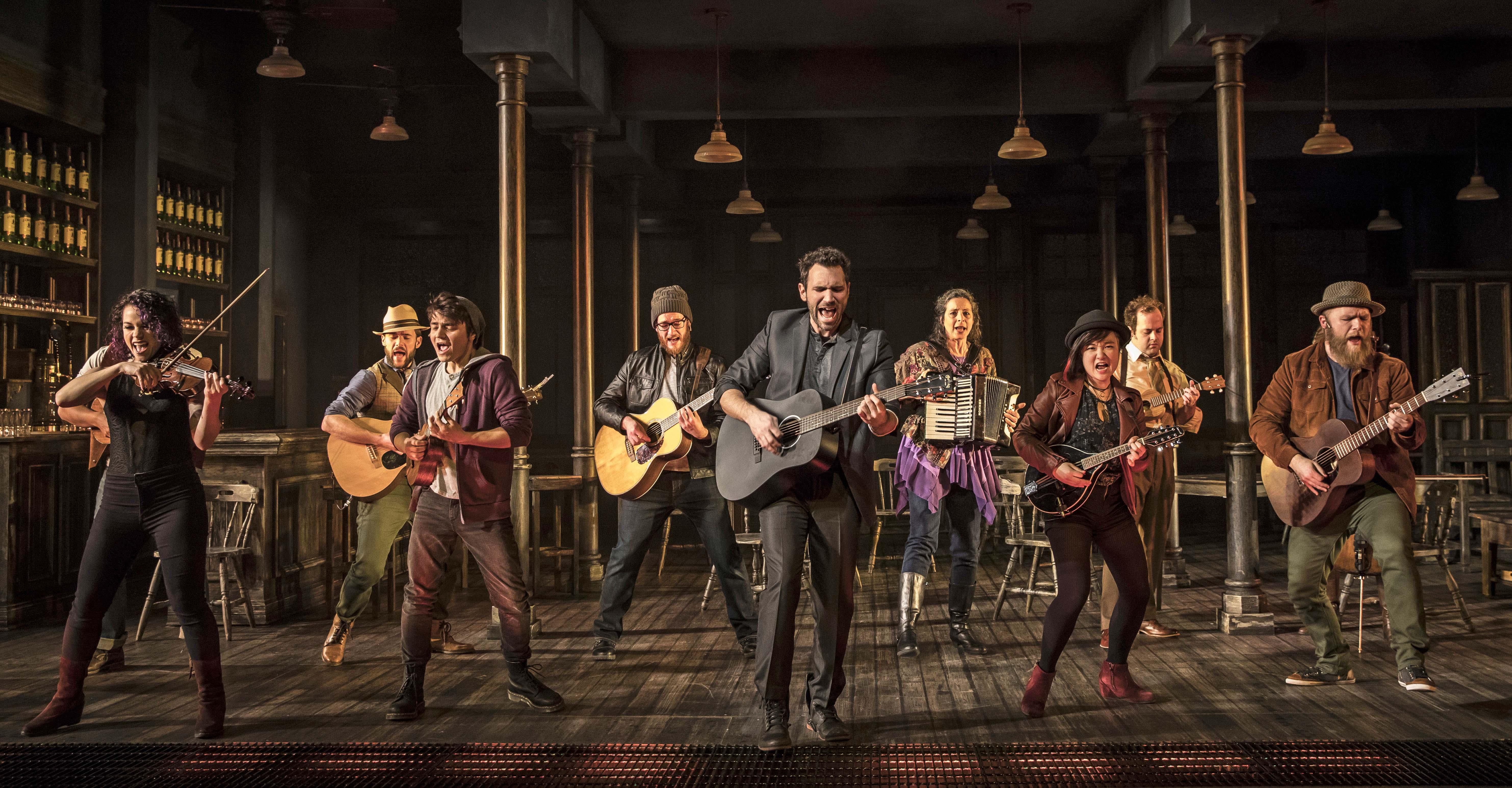 Barry DeBois, center, leads the band in “Once.” Also pictured, from left: Cassidy Stirtz, Doug Pawlik, Nik Kmiecik, Grant Alan Watkins, Jeanne T. Arrigo, Angel Lin, Alex E. Hardaway and Jon Patrick Penick. (Photo credit: Liz Lauren)