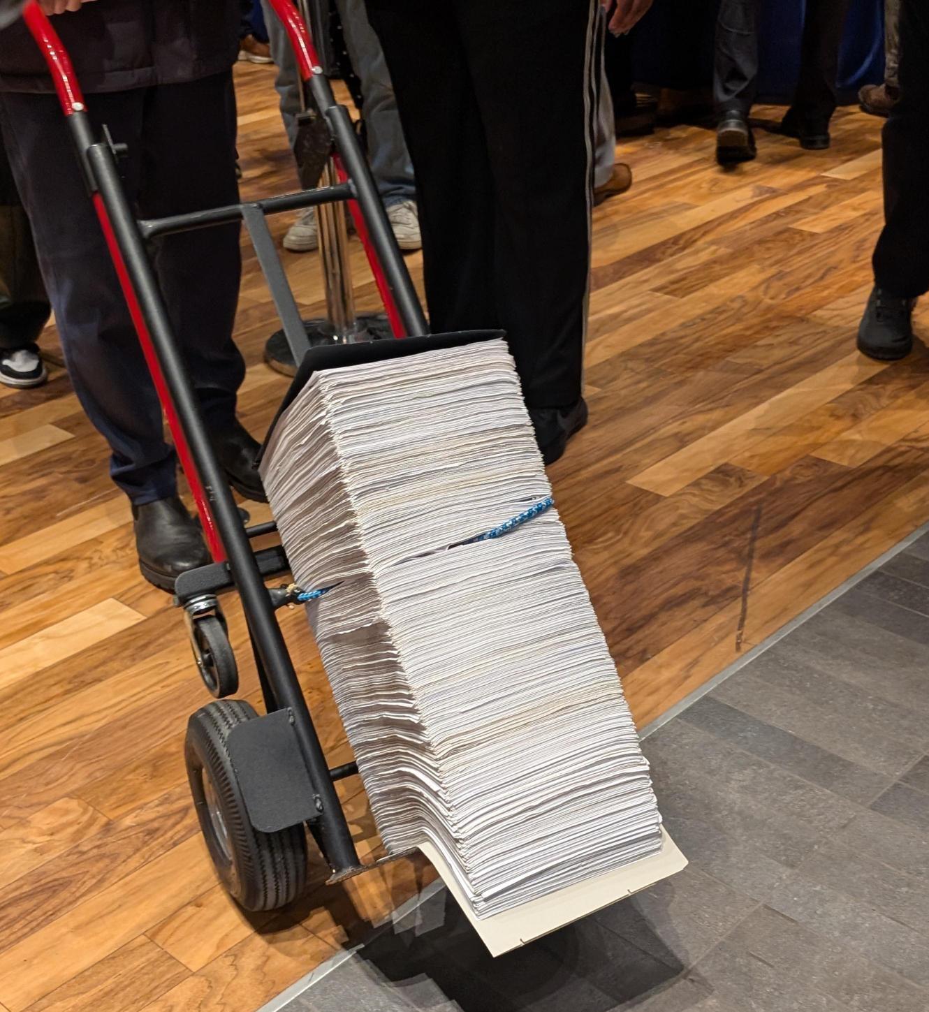 John Kelly wheels in his petitions on the first day of filing for Chicago’s mayoral race on Oct. 19, 2026. (Matt Masterson / WTTW News)