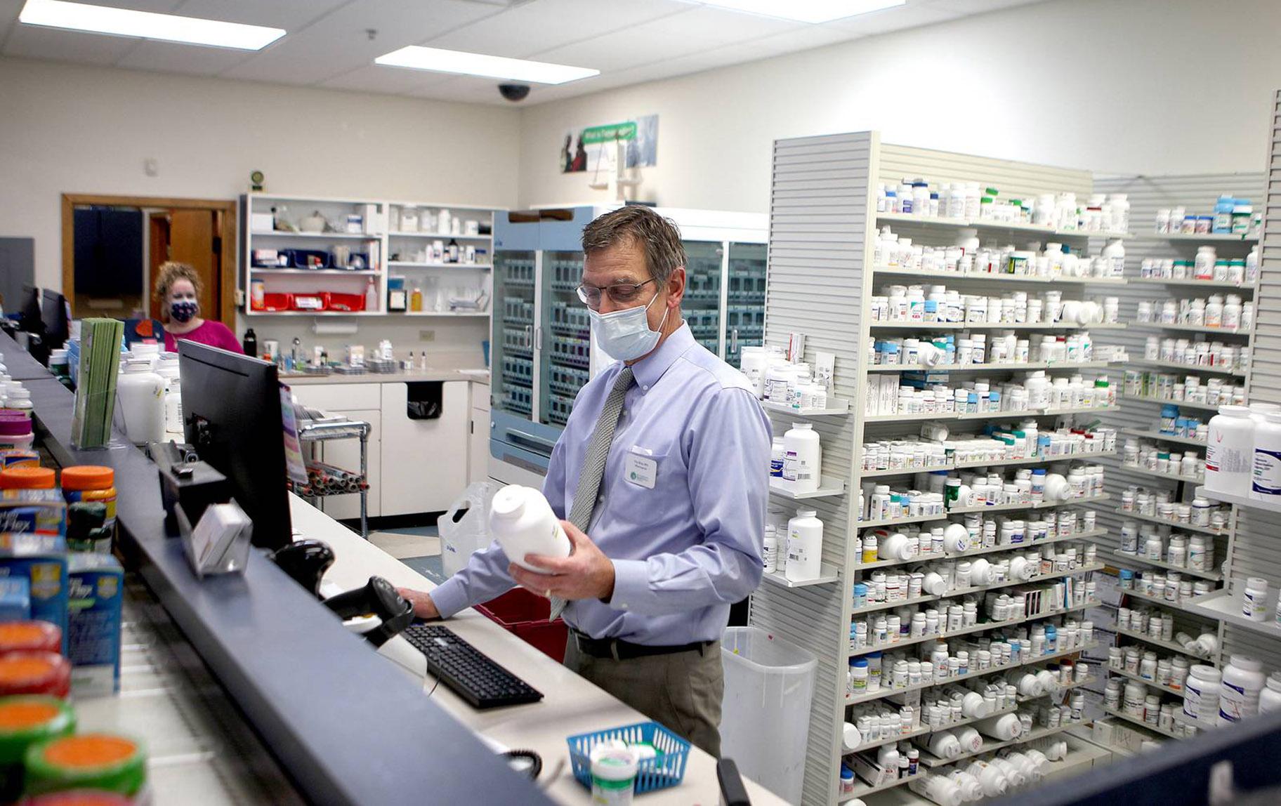 Pharmacist Tim Riley is one of more than a million workers who have kept showing up to work in person to keep the economy going. (Sandy Bressner / Shaw Local)