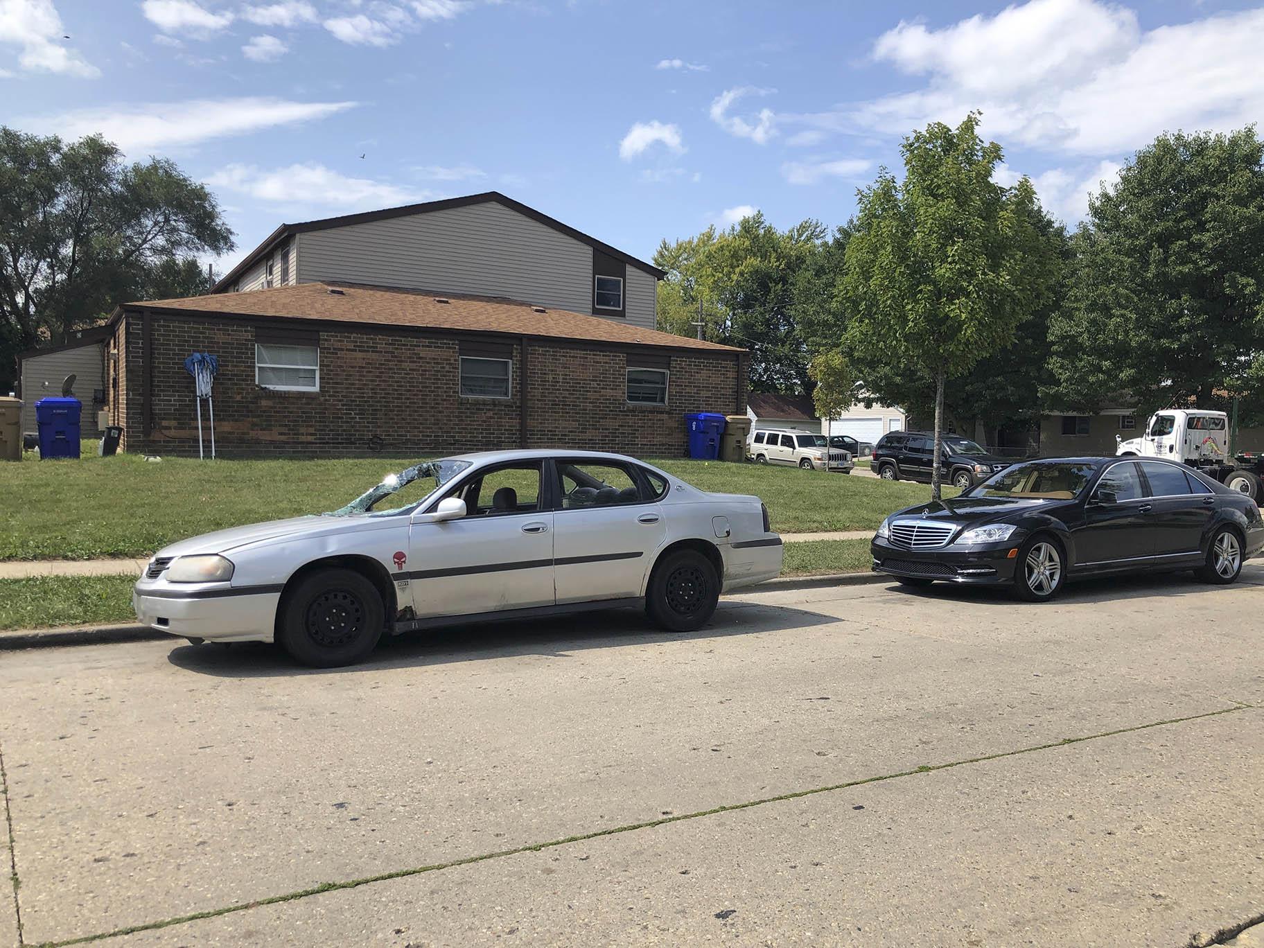 Vehicles are parked Friday, Aug. 28, 2020, in Kenosha, Wis., where Jacob Blake, a Black man, was shot by police on Aug. 23. (AP Photo / Russell Contreras)