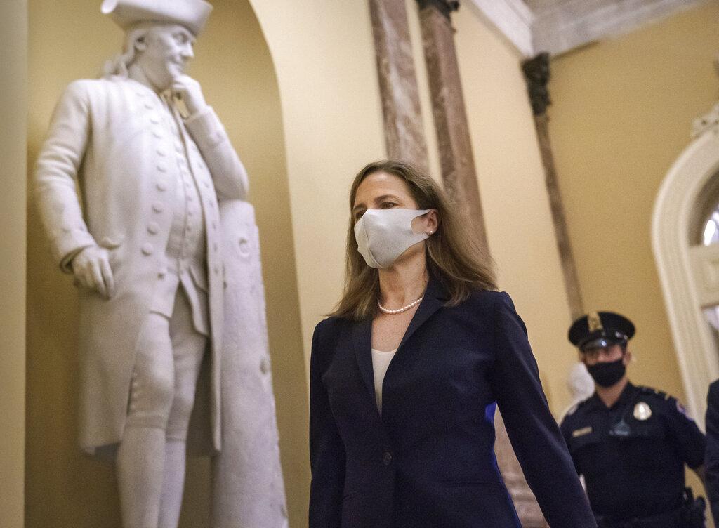 Judge Amy Coney Barrett, President Donald Trump’s nominee for the Supreme Court, arrives for closed meetings with senators, at the Capitol in Washington, Wednesday, Oct. 21, 2020. (AP Photo / J. Scott Applewhite)