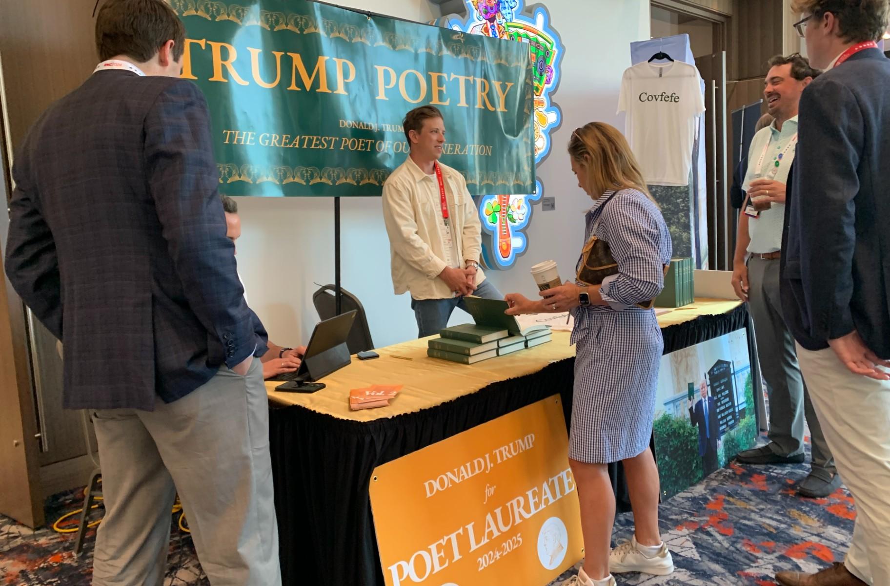 Gregory Woodman of Golden Goose Publishing Company speaks with guests about the poetry book he co-published, “Collected Poems of Donald J. Trump,” during the RNC on July, 17, 2024. (Eunice Alpasan / WTTW News)