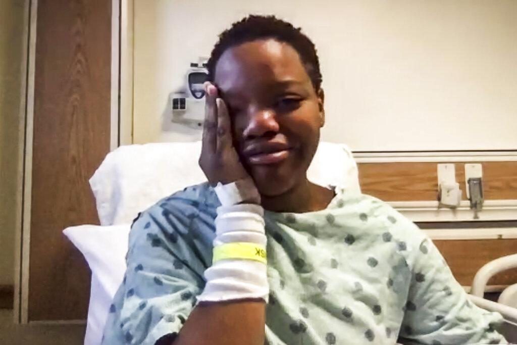 In this image taken from video, Tafara Williams speaking to reporters from her hospital bed during a Zoom meeting Tuesday, Oct. 27, 2020 in Libertyville, Ill. (Zoom / Chicago Sun-Times via AP)