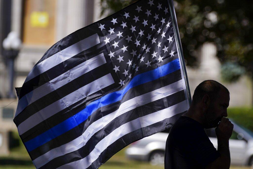 An unidentified man participates in a Blue Lives Matter rally Sunday, Aug. 30, 2020, in Kenosha, Wis. (AP Photo / Morry Gash)