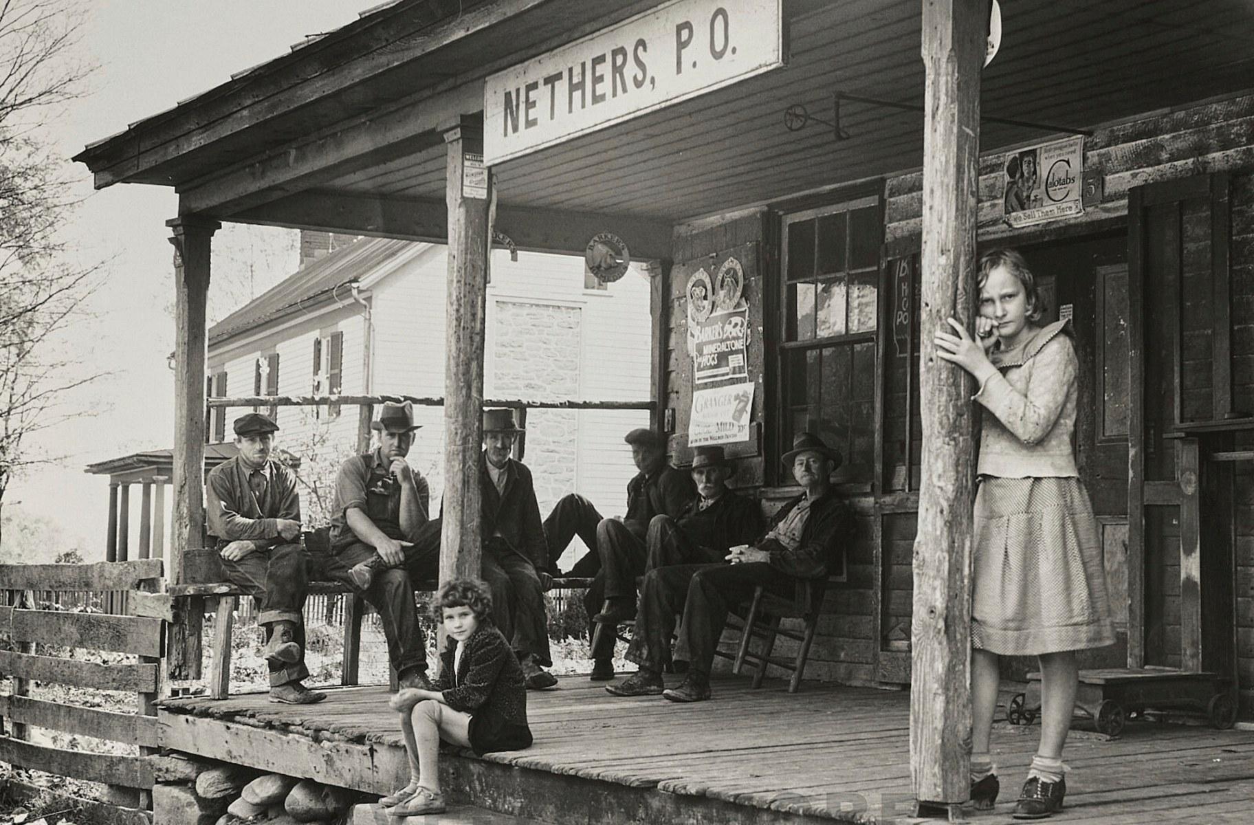 This photo provided by the Library of Congress shows people at the Nethers, Va., post office in Oct. 1935, during the Great Depression. (Arthur Rothstein / Farm Security Administration / Library of Congress via AP)