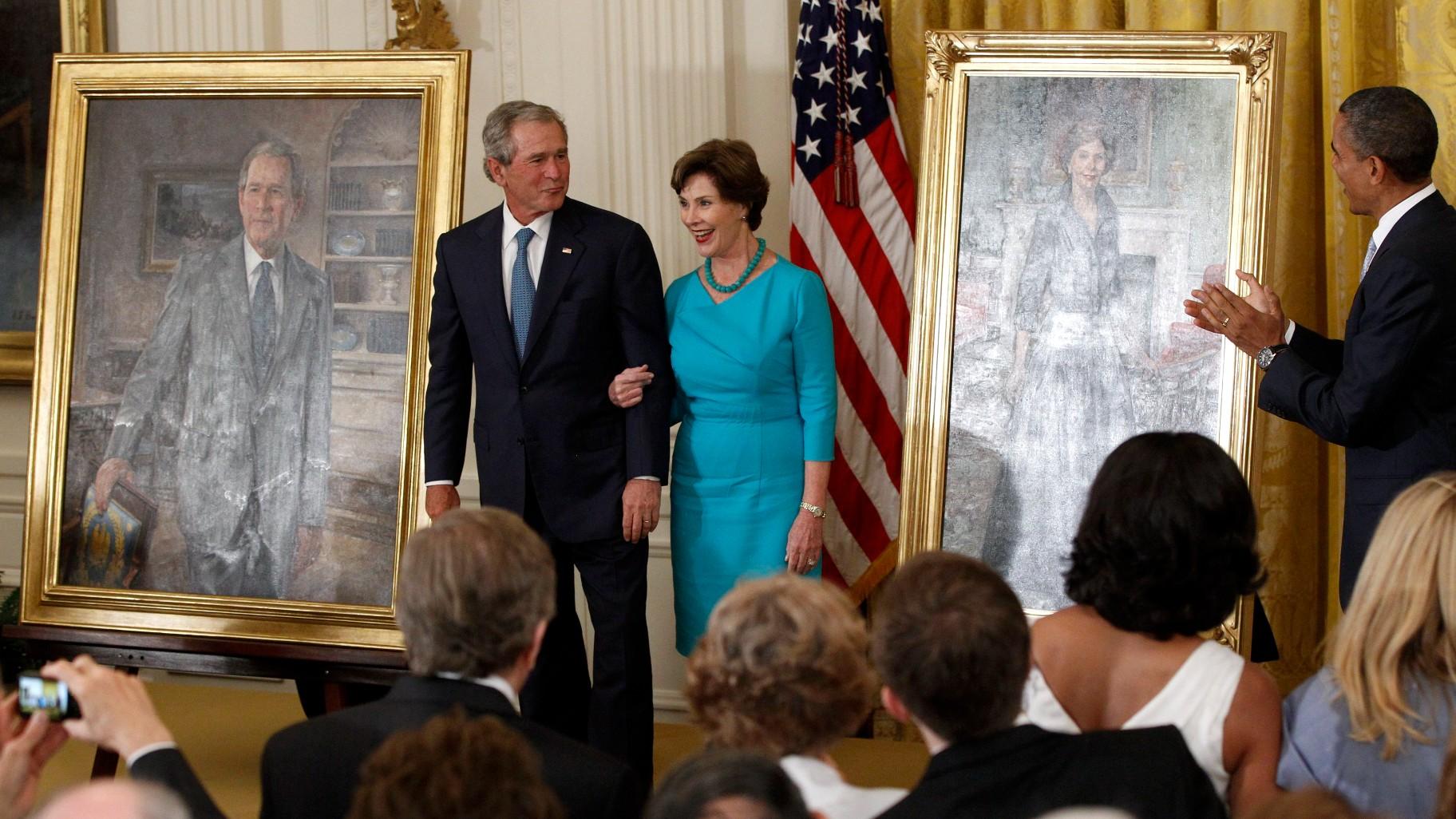 President Barack Obama applauds former President George W. Bush and former first lady Laura Bush during a ceremony in the East Room of the White House in Washington, May 31, 2012, where the Bush’s portraits were unveiled. (AP Photo / Charles Dharapak, File)