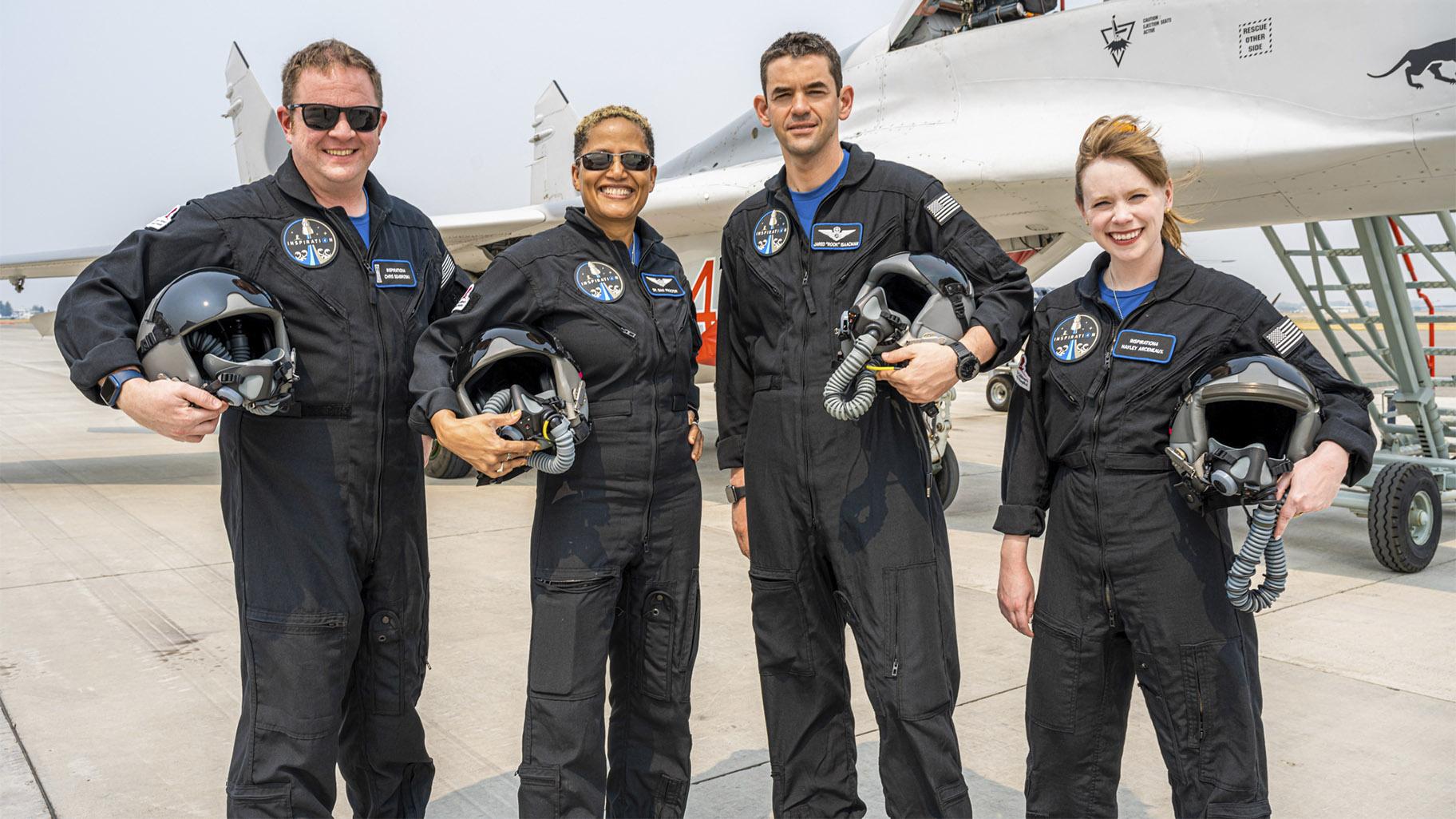 In this August 8, 2021 photo provided by John Kraus, left to right, Chris Sembroski, Sian Proctor, Jared Isaacman and Hayley Arceneaux stand for a photo in Bozeman, Mont., During a "fighter plane training" weekend to familiarize the crew with the G forces (John Kraus / Inspiration4 via AP)