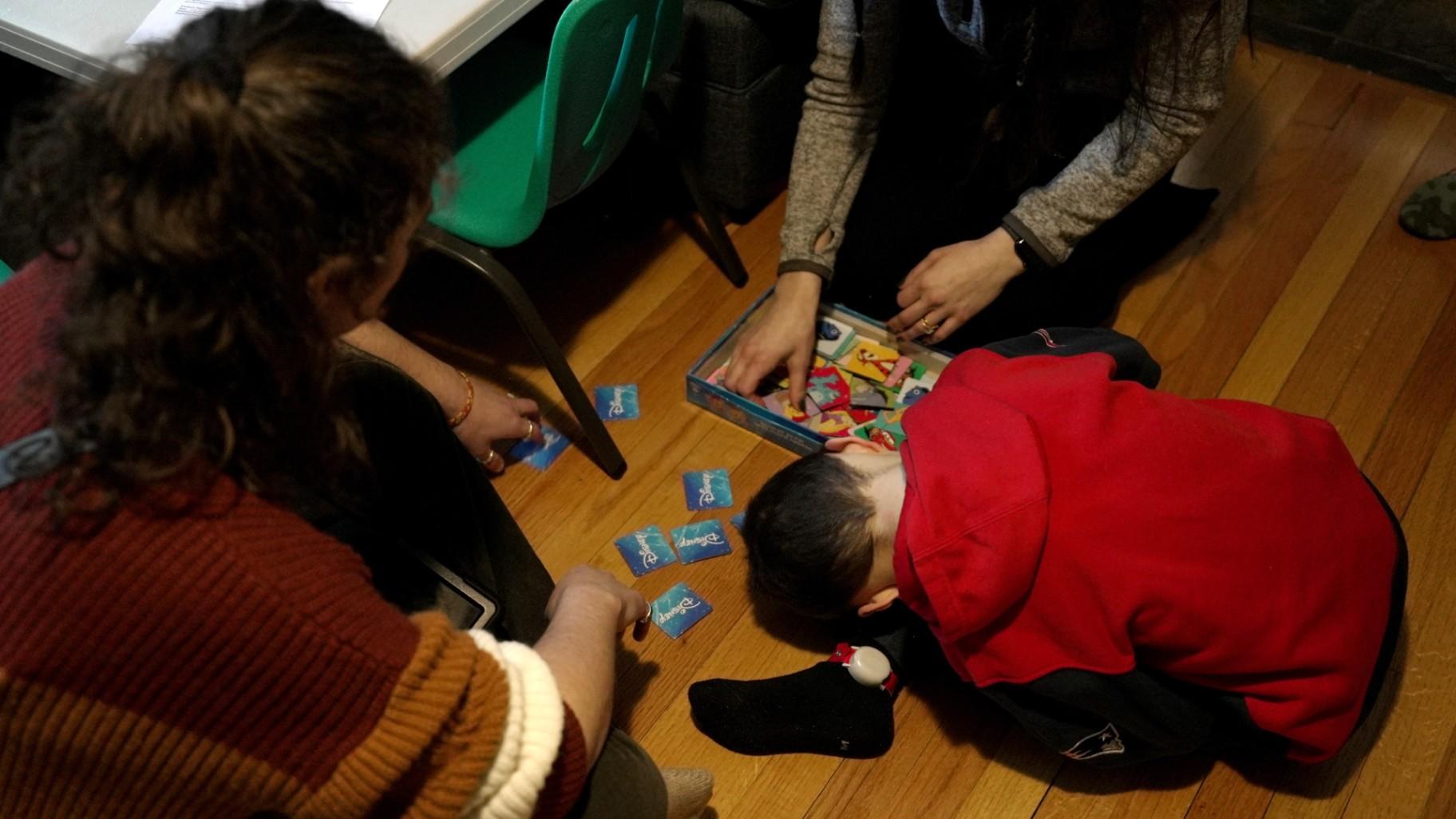 Connor Murphy takes a break from a matching problem during an applied behavior analysis after school in his home in Ayer, Mass., on Friday, Jan. 16, 2026. (AP Photo / Shelby Lum)