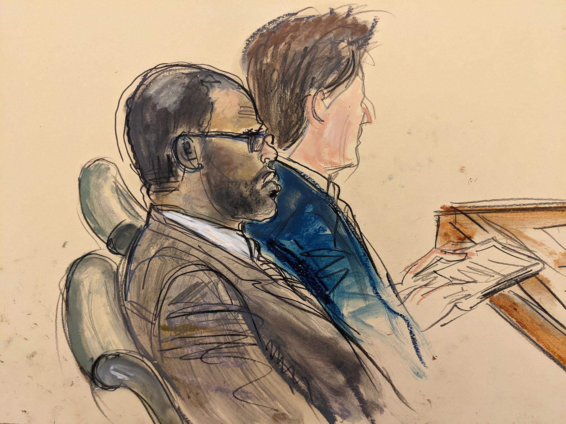 In this courtroom artist’s sketch made from a video screen monitor of a Brooklyn courtroom, defendant R. Kelly, left, listens during the opening day of his trial, Wednesday, Aug. 18, 2021 in New York. (AP Photo / Elizabeth Williams)