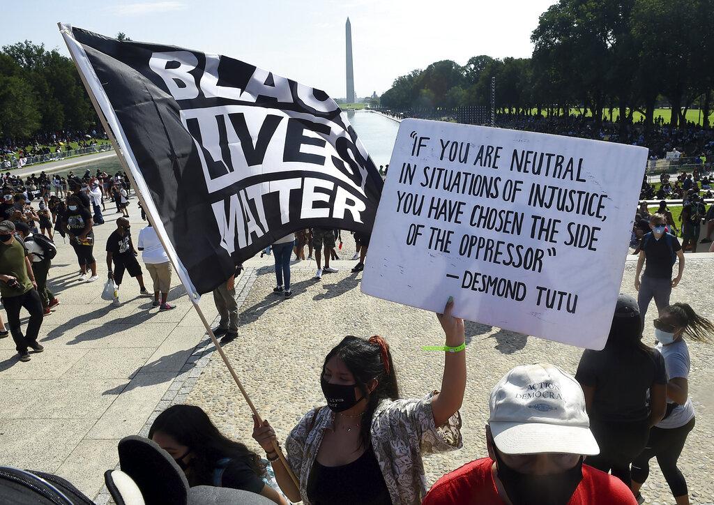 In this Aug. 28, 2020, file photo, demonstrators gather near the Lincoln Memorial as final preparations are made for the March on Washington, in Washington, on the 57th anniversary of the Rev. Martin Luther King Jr.’s “I Have A Dream” speech. (Olivier Douliery / Pool Photo via AP, File)