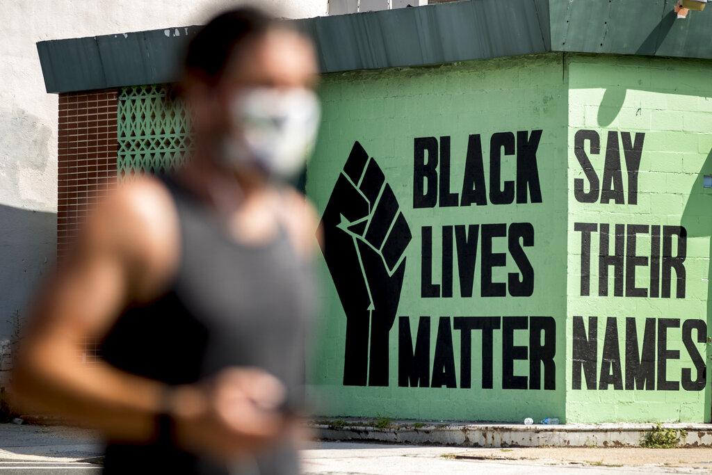 In this July 13, 2020, file photo, a black lives matter mural is visible in the Shaw neighborhood in Washington. (AP Photo / Andrew Harnik, File)