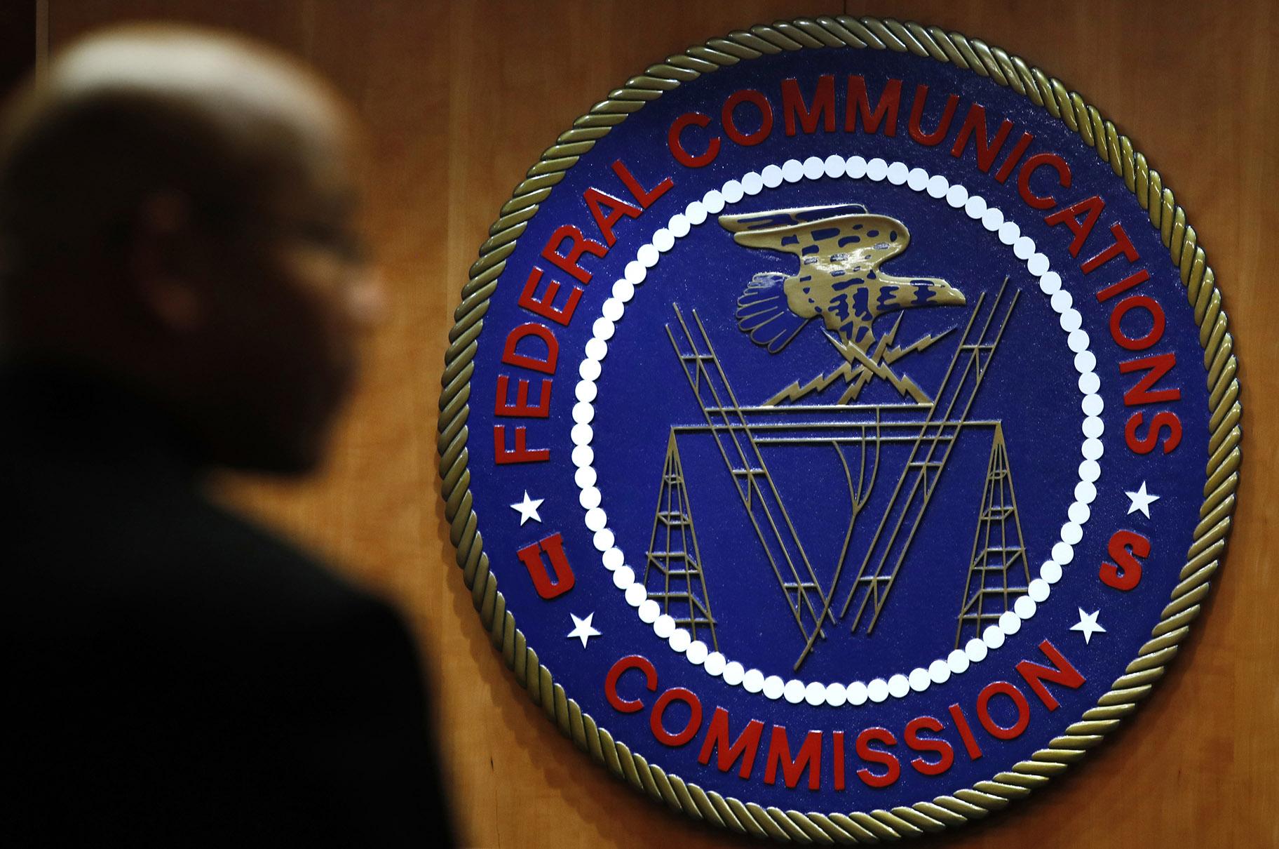 This Dec. 14, 2017, file photo, shows the seal of the Federal Communications Commission (FCC) before a meeting in Washington. (AP Photo / Jacquelyn Martin, File)