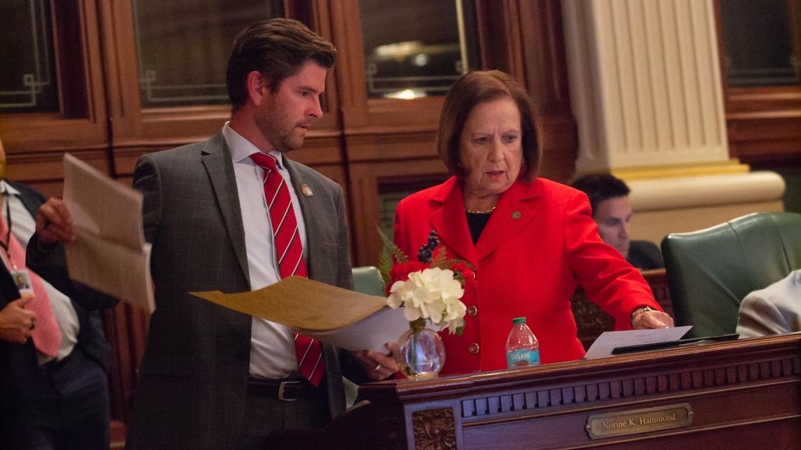 State Rep. Ryan Spain, R-Peoria, and Norrine Hammond, R-Macomb, converse on the House floor during debate of the state budget. (Capitol News Illinois photo by Jerry Nowicki)