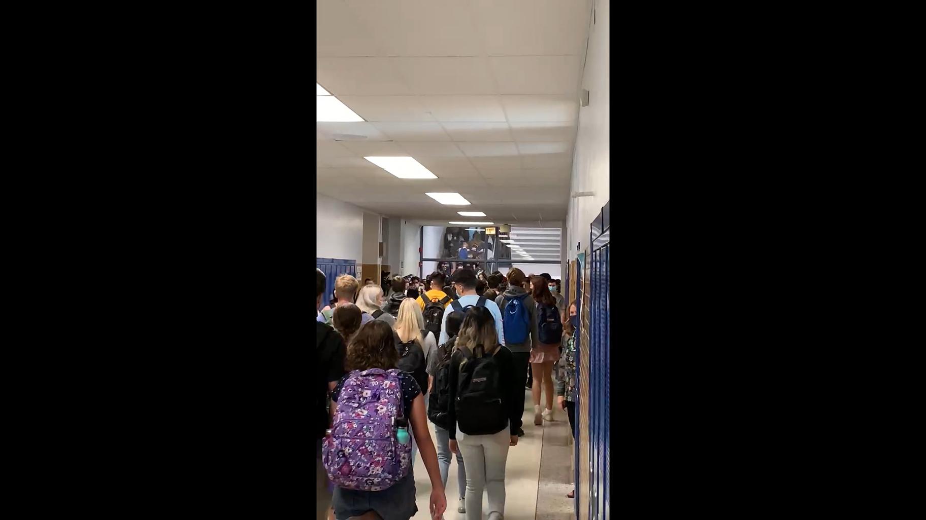 A screenshot from a video shared with WTTW News shows a crowded hallway at Taft High School
