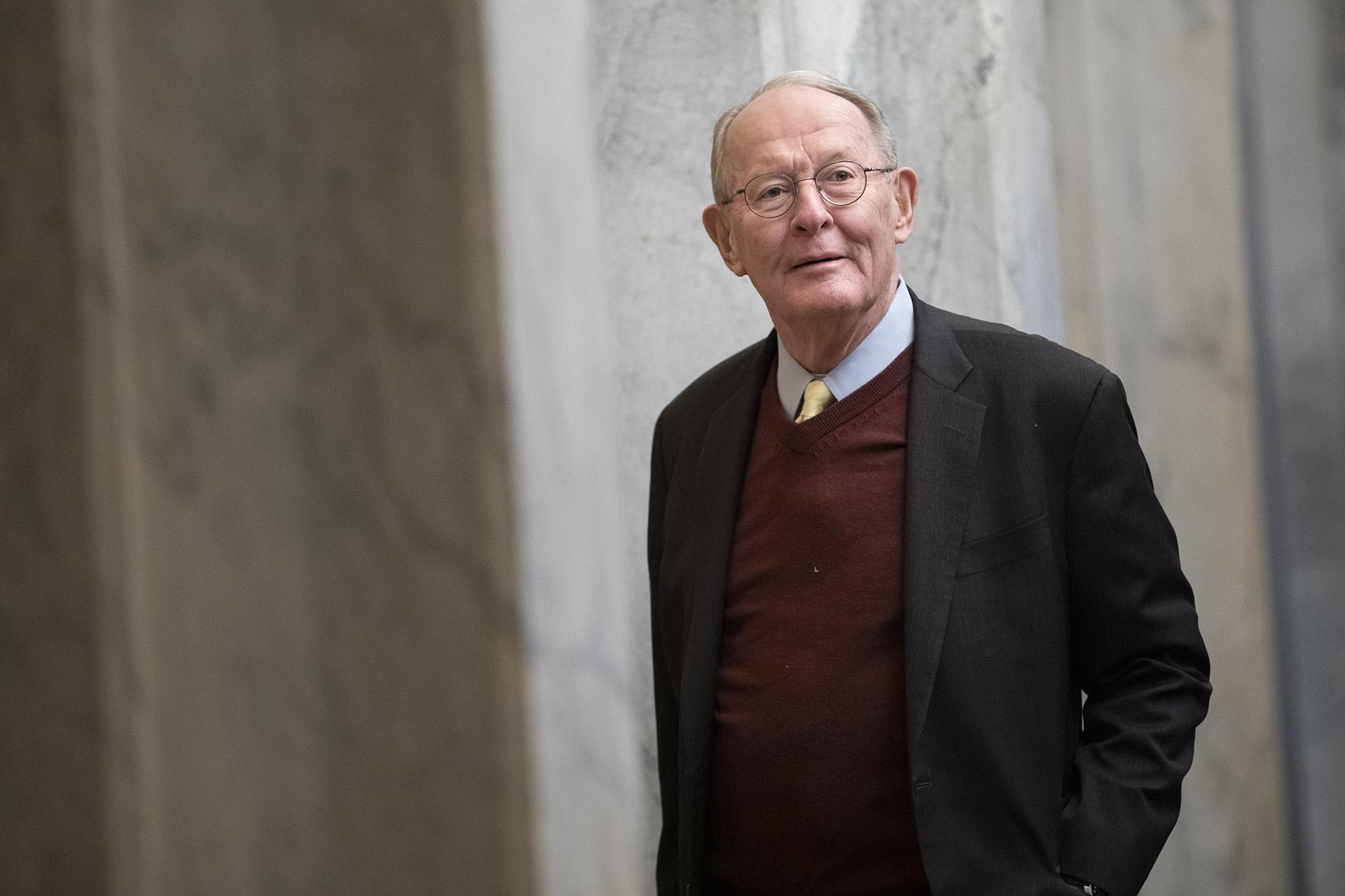 Sen. Lamar Alexander, R-Tenn., arrives on Capitol Hill in Washington, Thursday, Jan. 30, 2020, before the impeachment trial of President Donald Trump on charges of abuse of power and obstruction of Congress. (AP Photo/ Jacquelyn Martin)