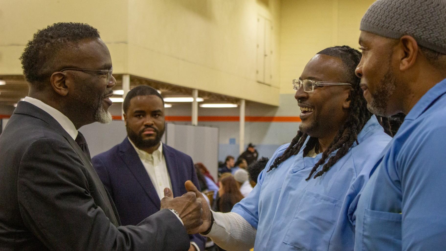 Chicago Mayor Brandon Johnson shakes hands with the incarcerated students of the Northwestern Prison Education Program, which offers undergraduate degrees to men incarcerated at Sheridan Correctional Center, on Sunday, March 15, 2026.