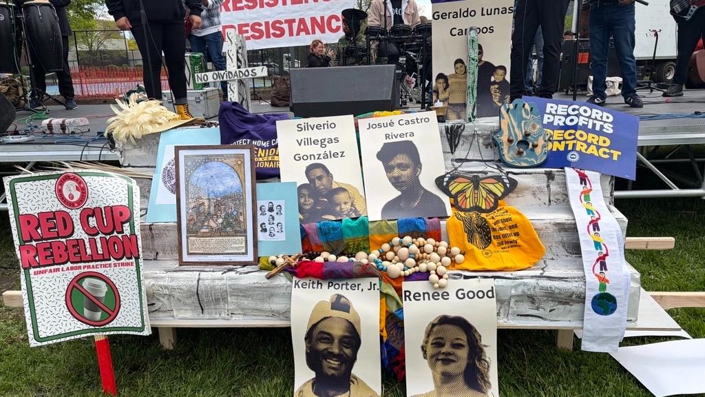 Signs lean against the stage in Union Park in advance of a planned May Day rally on May 1, 2026. (Eunice Alpasan / WTTW News)