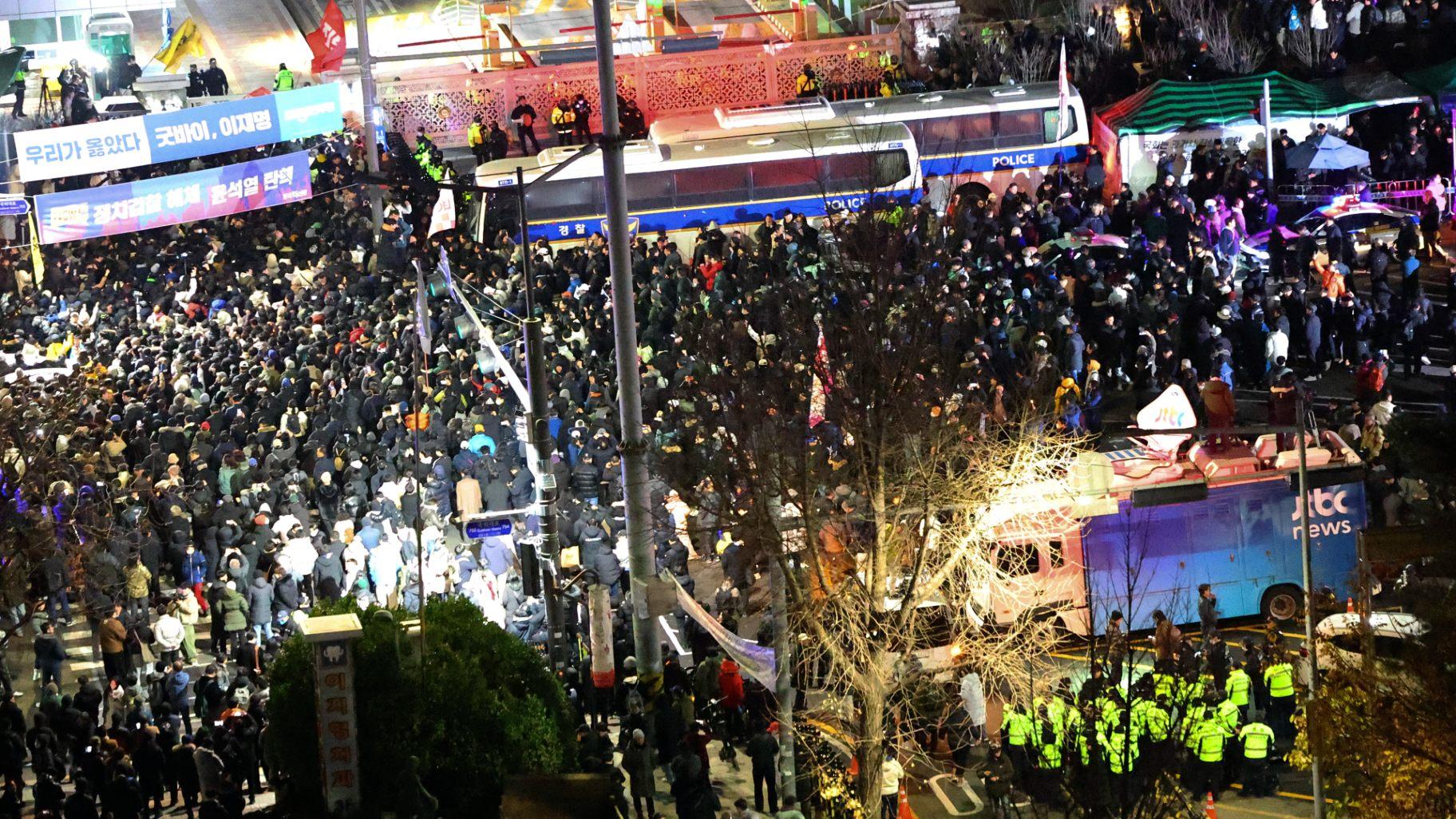 People gather to demand South Korean President Yoon Suk Yeol step down in front of the National Assembly in Seoul, South Korea, Wednesday, Dec. 4, 2024. (Kim Do-hoon / Yonhap via AP)