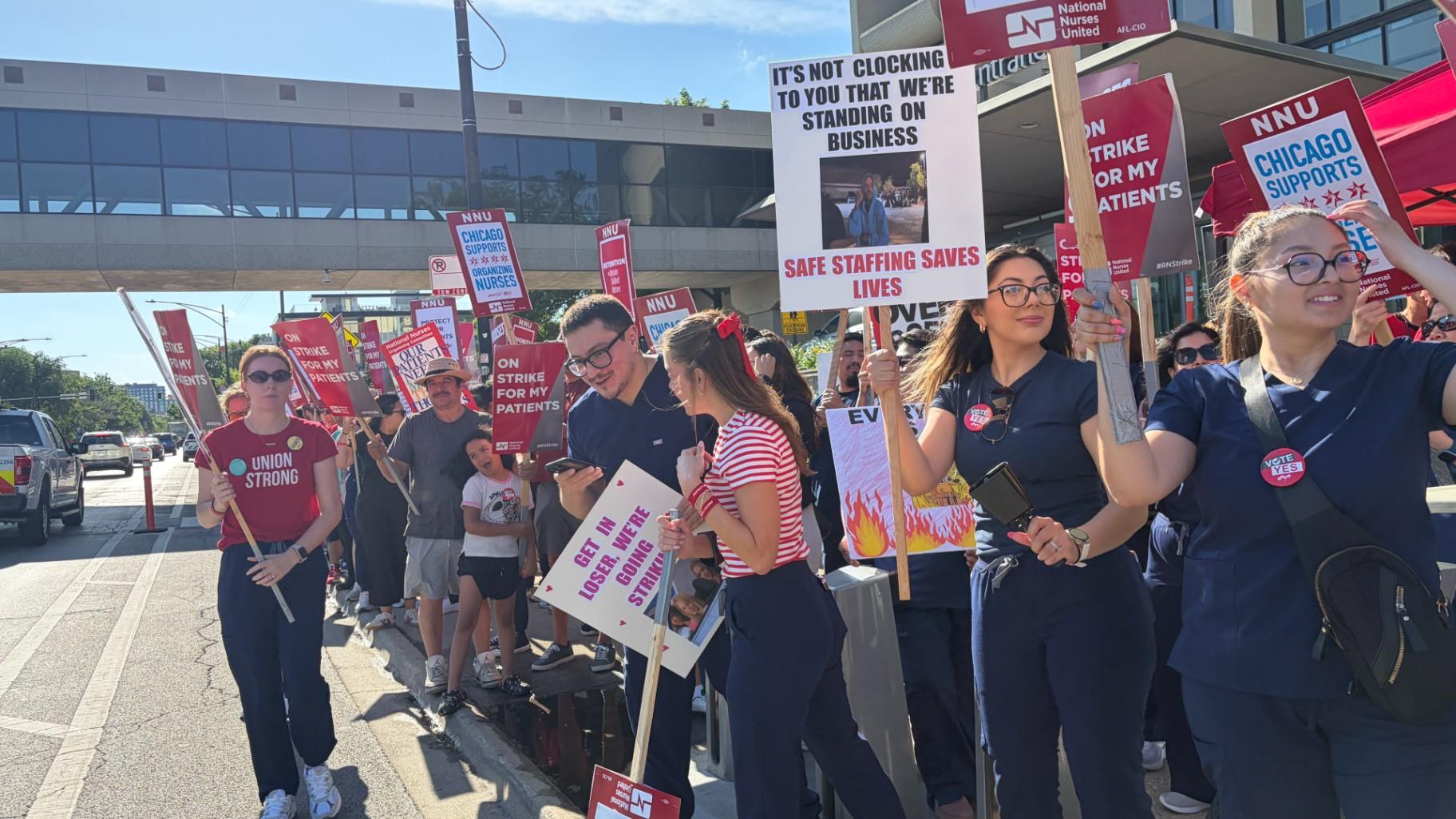 Nurses and supporters picket outside Saint Mary of Nazareth Hospital on June 11, 2026. (Eunice Alpasan / WTTW News)