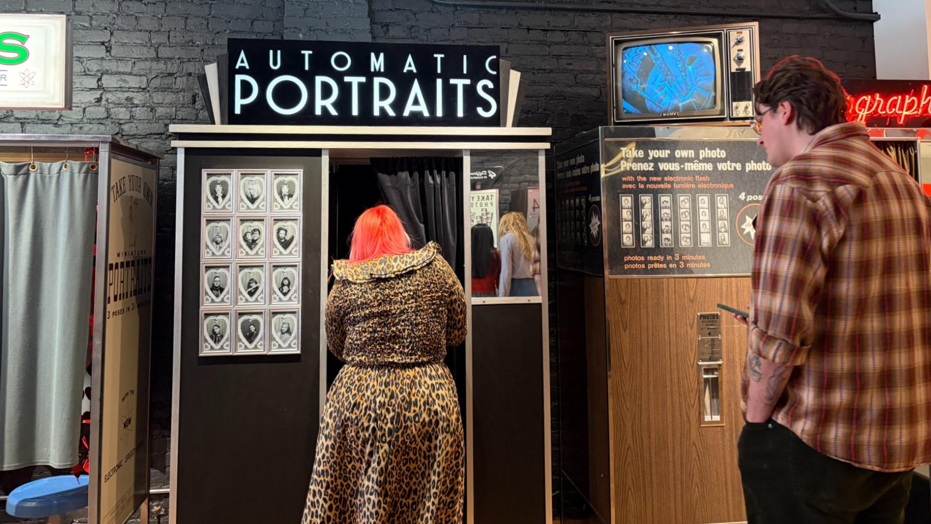 Patrons use a photo booth at the Strip Club Photobooth Studio in Bucktown on Feb. 10, 2026. (Eunice Alpasan / WTTW News)
