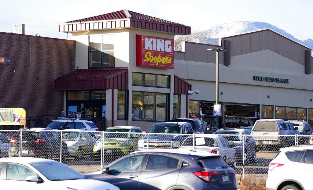 A makeshift fence stands around the parking lot outside a King Soopers grocery store where a mass shooting took place a day earlier in Boulder, Colo., Tuesday, March 23, 2021. (AP Photo / David Zalubowski)