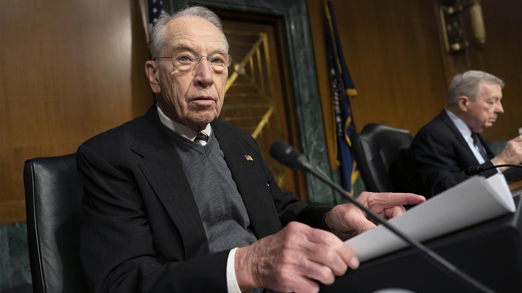 Sen. Chuck Grassley, R-Iowa, the ranking member of the Senate Judiciary Committee, joined at right by Chairman Dick Durbin, D-Ill., prepares for a meeting to advance President Joe Biden's nominees to the federal courts, at the Capitol in Washington, on Feb. 17, 2022.  AP Photo / J. Scott Applewhite, File)