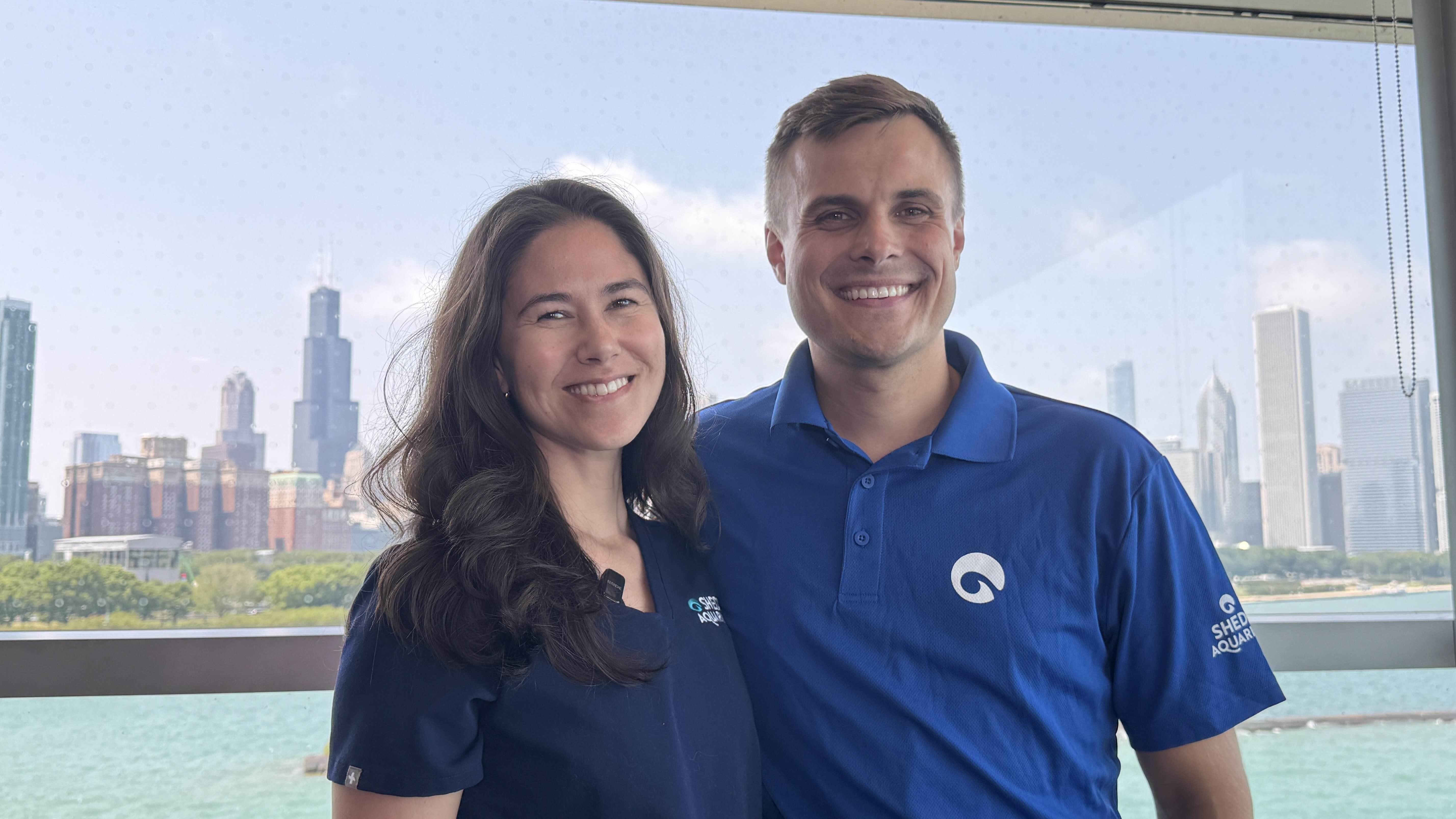 Dr. Karisa Tang, lead veterinarian and vice president of animal health at Shedd Aquarium, and Charlie Jacobsma, director of animal behavior and training, have played key roles in the effort to rescue 30 beluga whales from a marine park in Canada. (Patty Wetli / WTTW News) 