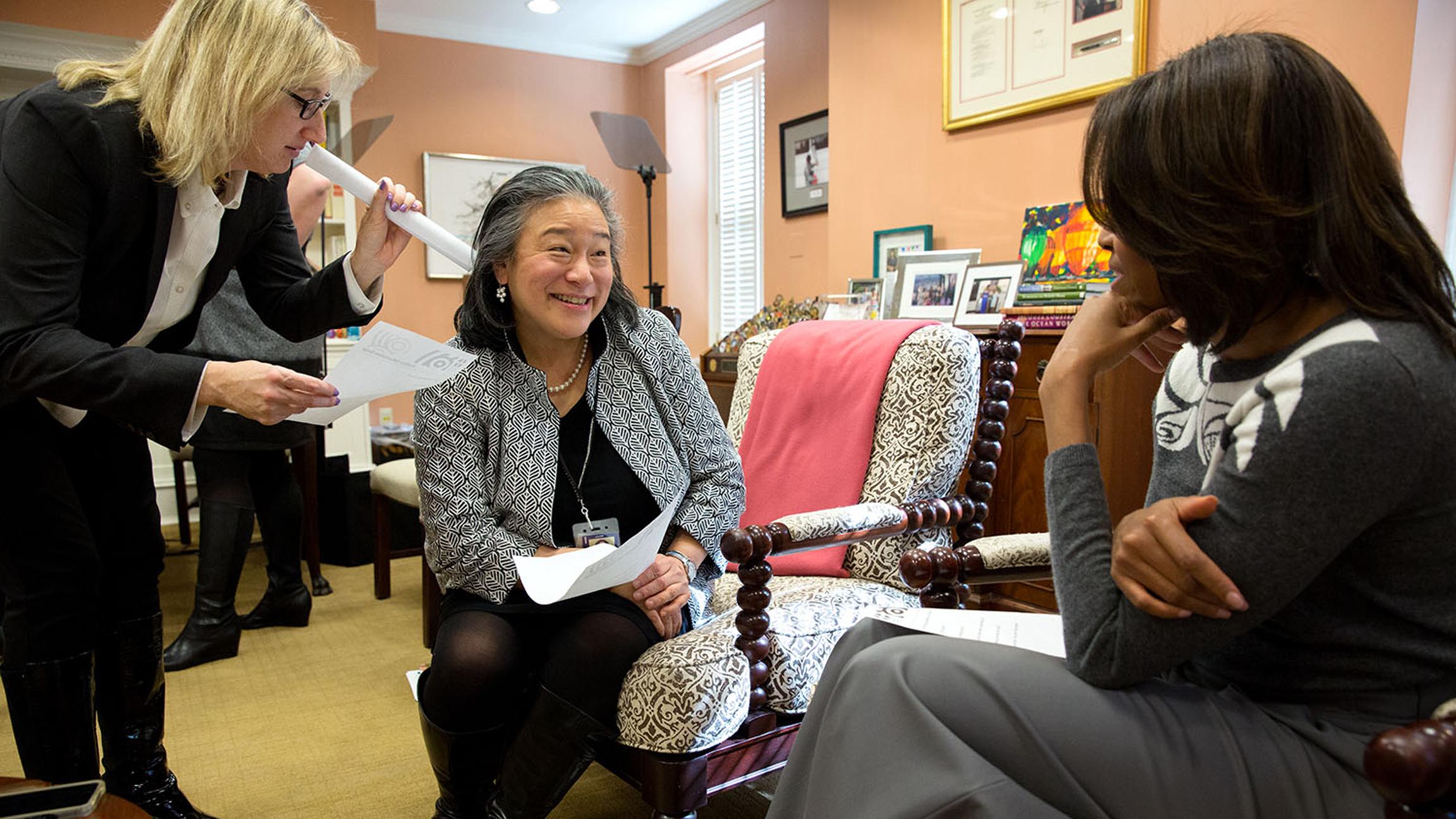Tina Tchen, center, speaks with Michelle Obama. (Pete Souza / The White House)