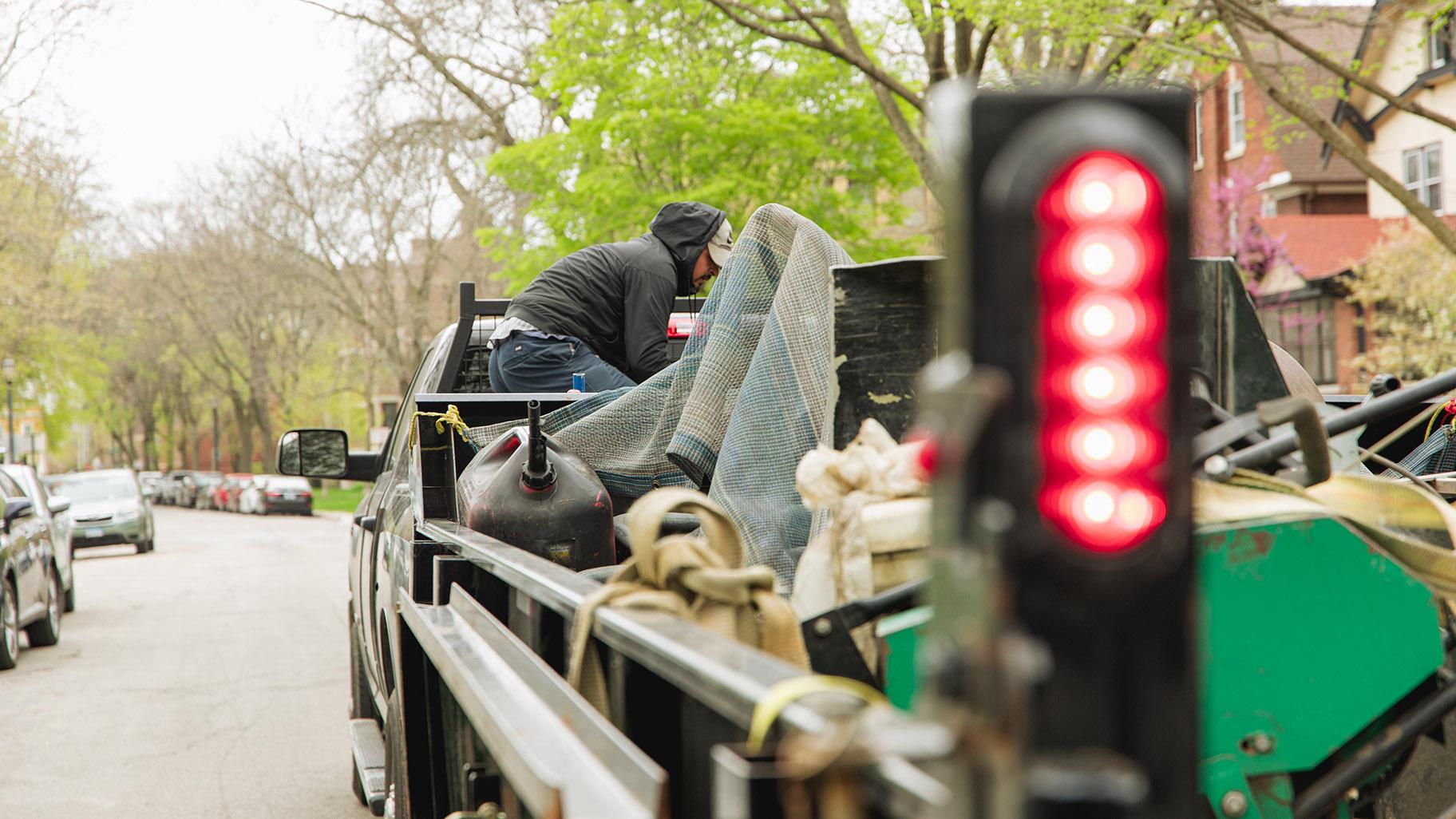 Rafael Villanueva’s landscaping crew prepares to work on an Evanston lawn on April 23, 2024. (Michael Izquierdo / WTTW News)