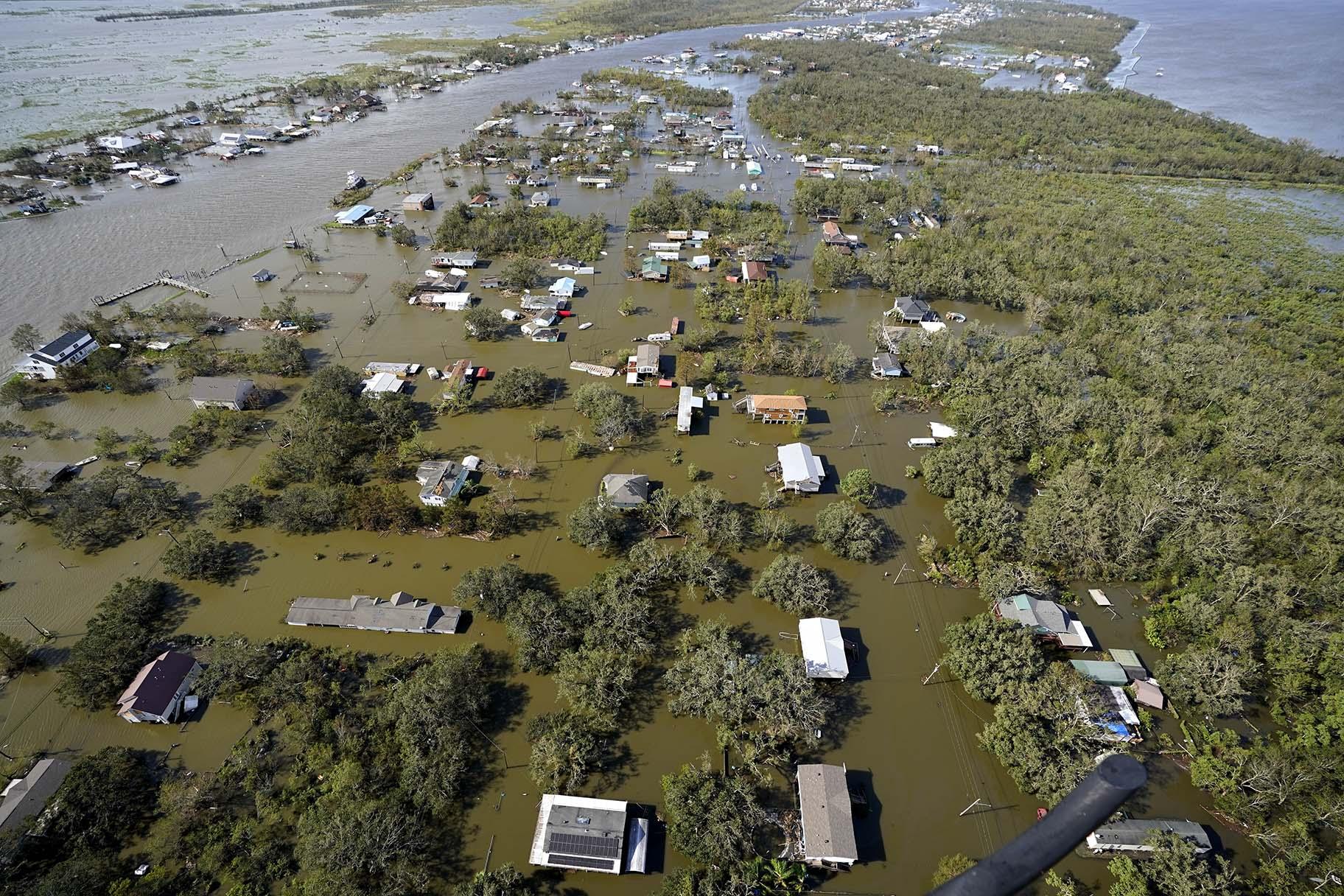 Homes are flooded in the aftermath of Hurricane Ida, Monday, Aug. 30, 2021, in Lafitte, La. The weather died down shortly before dawn. (AP Photo / David J. Phillip)