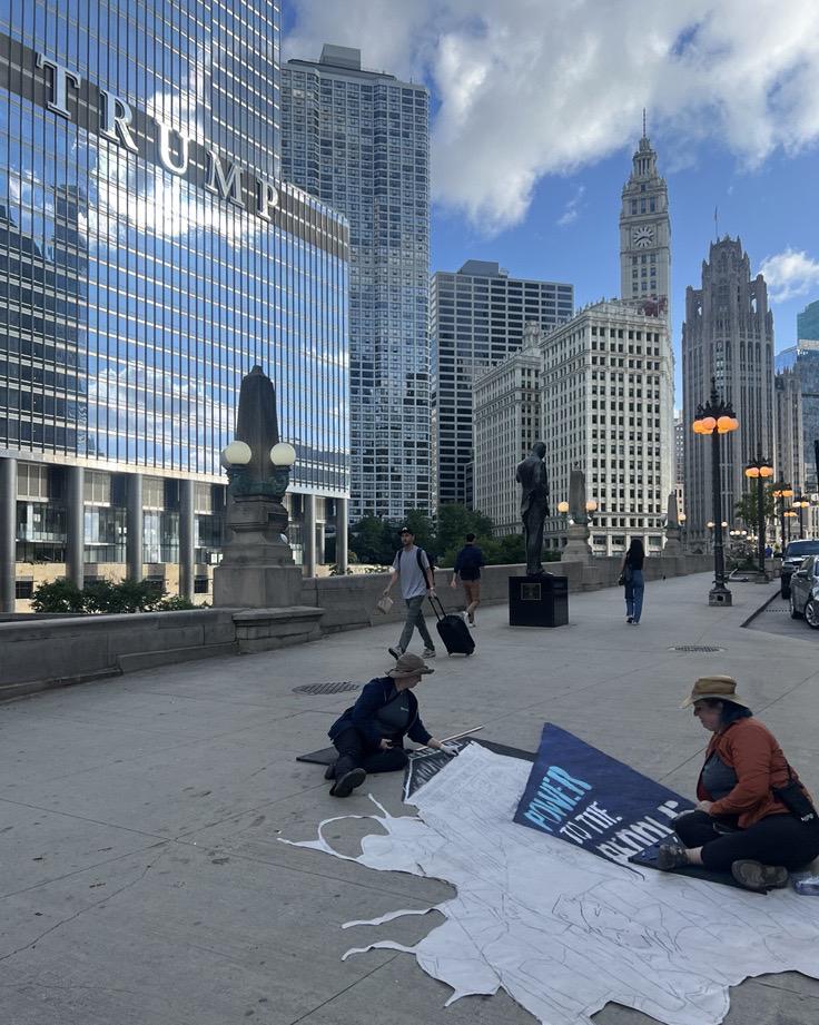 A sidewalk mural is drawn outside of Trump Tower in Chicago. (Amanda Vinicky / WTTW News)
