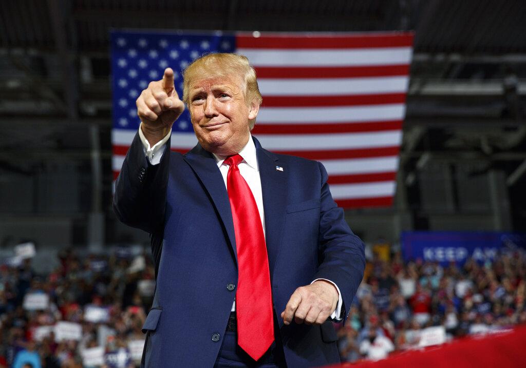 In this Wednesday, July 17, 2019 file photo, President Donald Trump gestures to the crowd as he arrives to speak at a campaign rally at Williams Arena in Greenville, N.C. (AP Photo / Carolyn Kaster, File)
