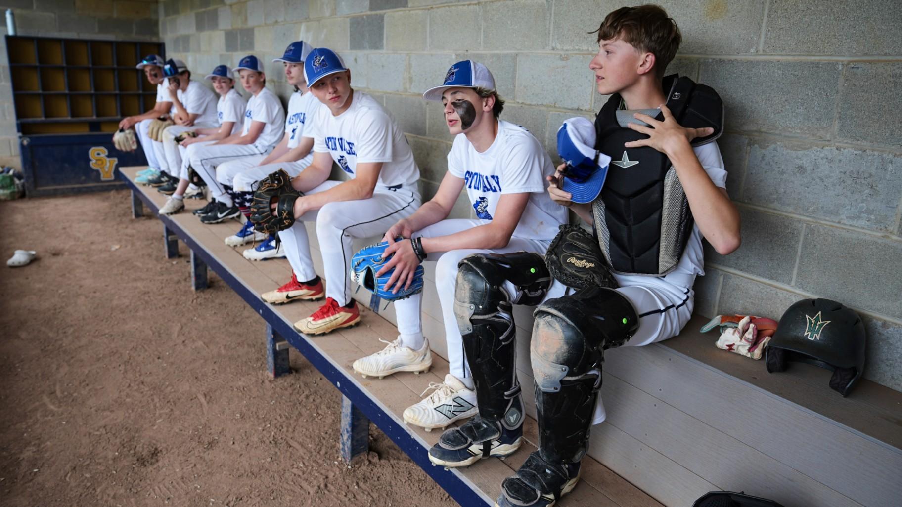Jax Casamento, right, 15, waits prepares for the start of his youth baseball game in Aston, Pa., Tuesday, May 27, 2025. (AP Photo / Matt Rourke)