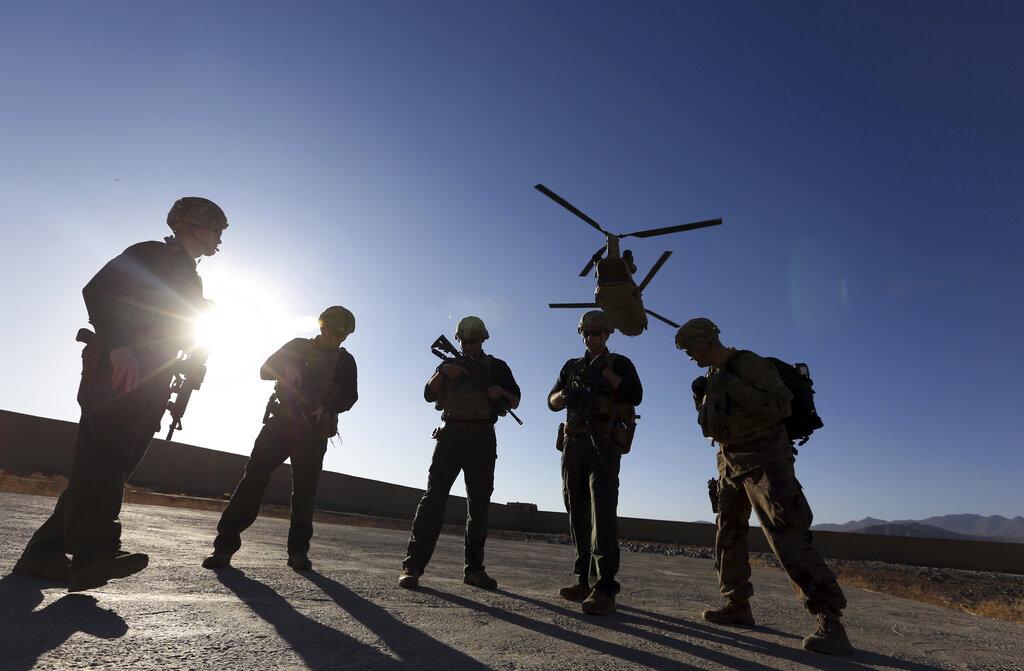 In this Nov. 30, 2017 file photo, American soldiers wait on the tarmac in Logar province, Afghanistan. (AP Photo / Rahmat Gul, File)