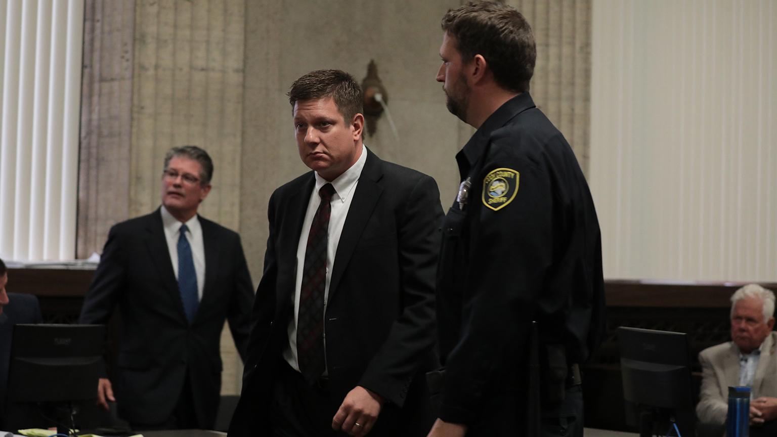 Sheriff’s deputies escort Chicago police Officer Jason Van Dyke from the courtroom Thursday, Sept. 6, 2018, after Judge Vincent Gaughan’s ruling that ordered Van Dyke’s bail be raised only slightly for giving an interview to the Chicago Tribune and a local TV station just days before jury selection was set to begin in his murder trial. (Antonio Perez / Chicago Tribune / Pool)