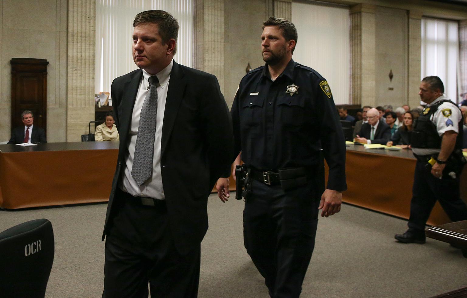 Chicago police Officer Jason Van Dyke is led out of the courtroom following the verdict announcement Friday, Oct. 5, 2018. (Antonio Perez / Chicago Tribune / Pool) 