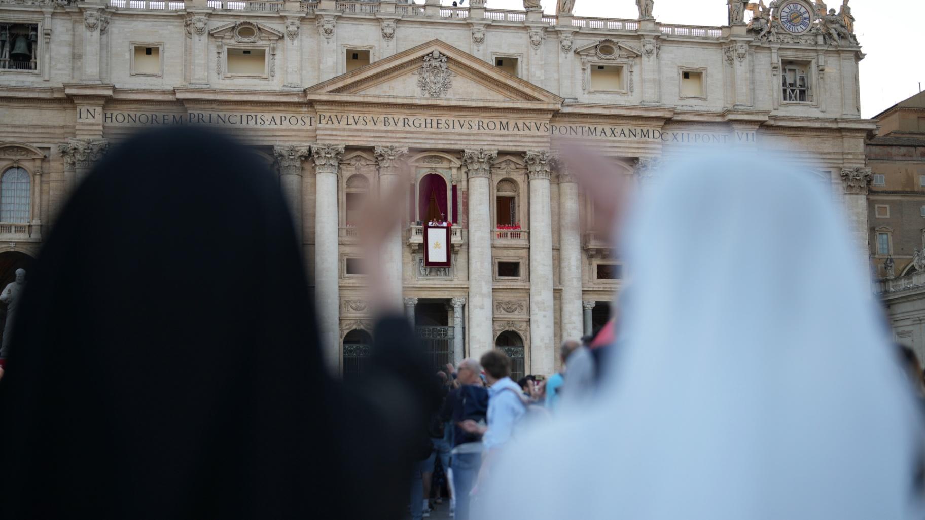 Nuns react during the speech of the newly elected Pope Leo XIV at the Vatican, Thursday, May 8, 2025. (AP Photo/Francisco Seco)
