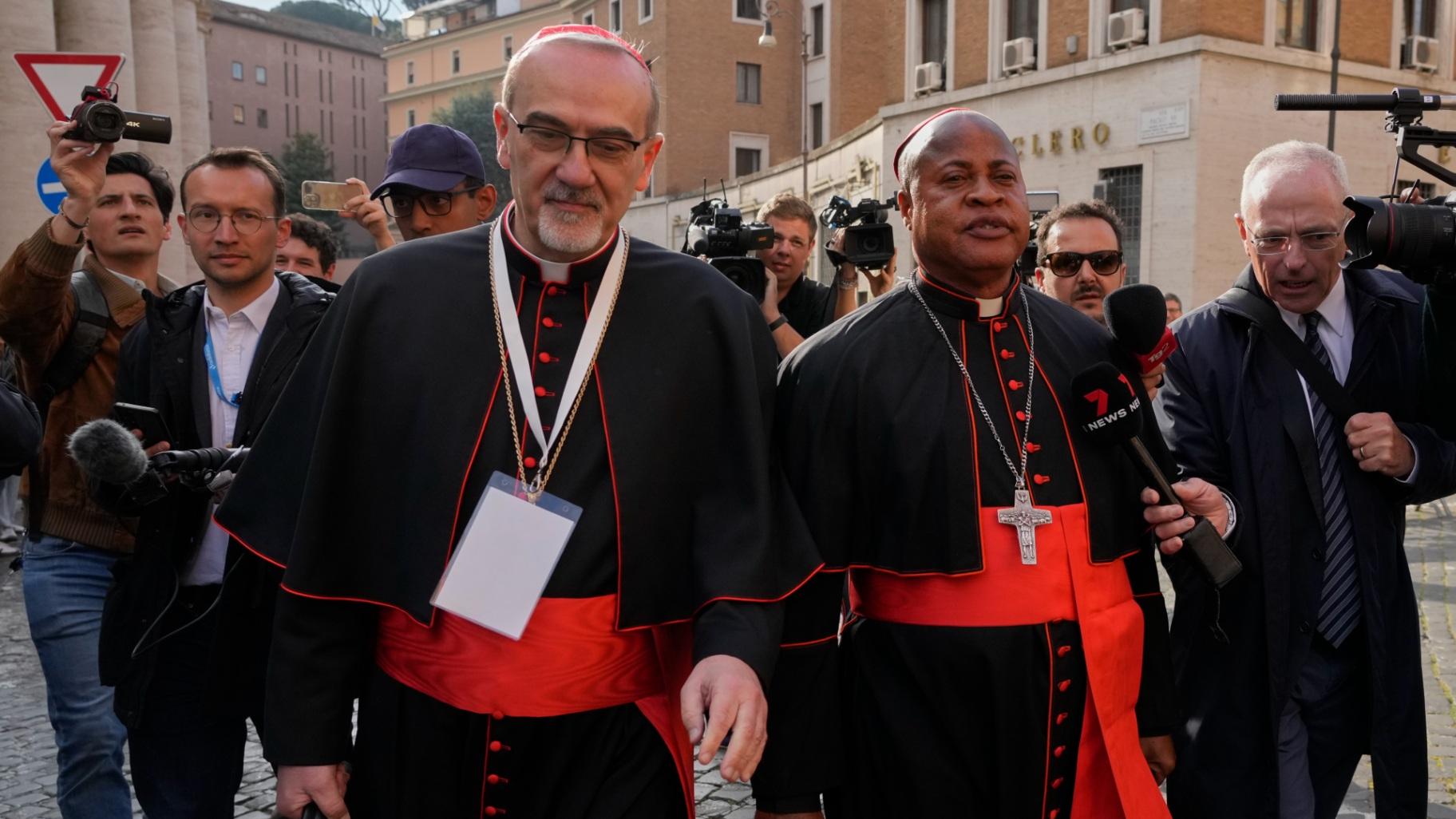 Cardinal Pierbattista Pizzaballa, left, and Cardinal Fridolin Ambongo Besungu arrive for a college of cardinals' meeting, at the Vatican, Monday, April 28, 2025. (AP Photo / Gregorio Borgia)