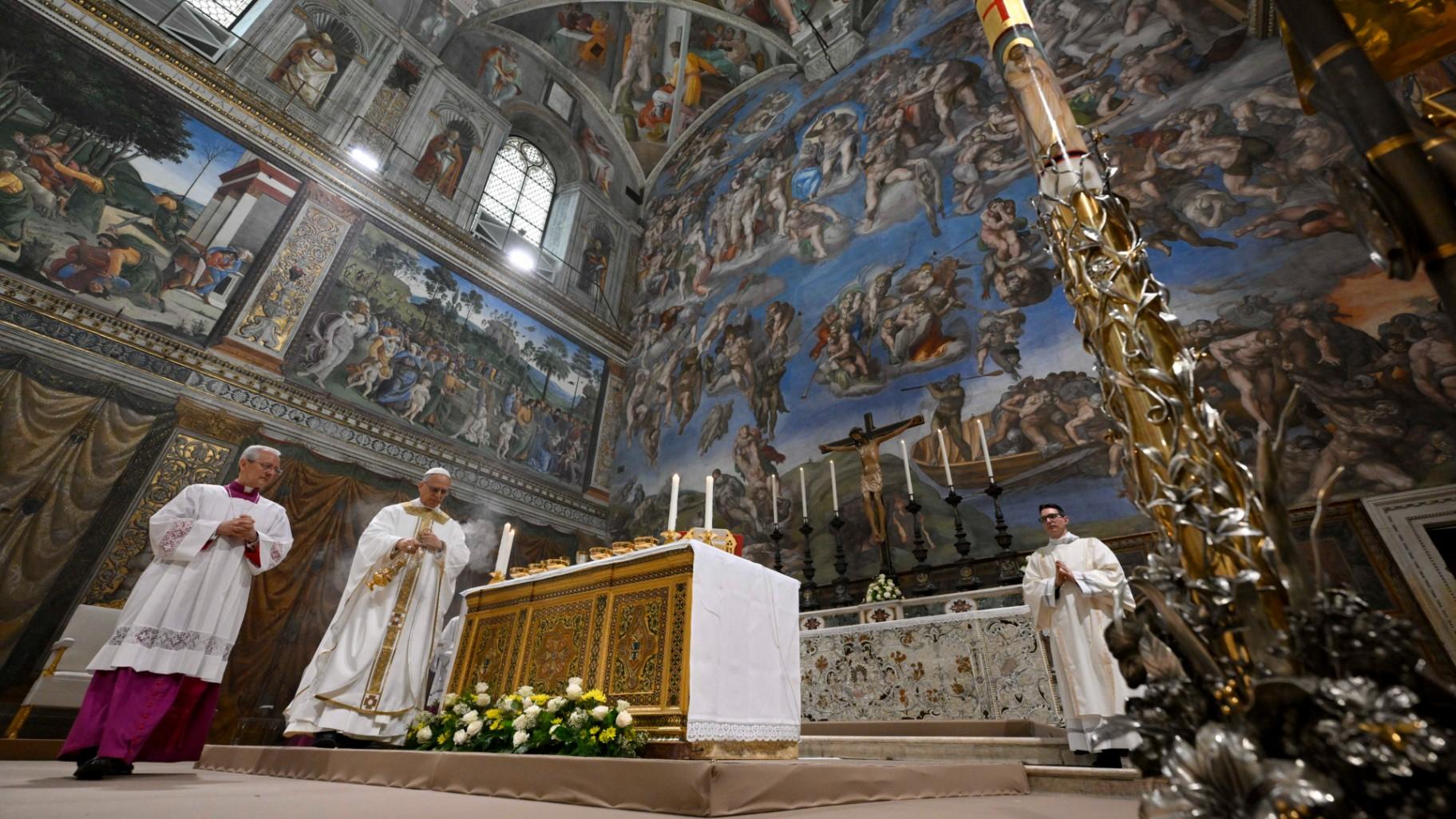 Newly elected Pope Leo XIV, second from left, concelebrates Mass with the College of Cardinals inside the Sistine Chapel at the Vatican the day after his election as 267th pontiff of the Roman Catholic Church, Friday, May 9, 2025. (Vatican Media via AP)