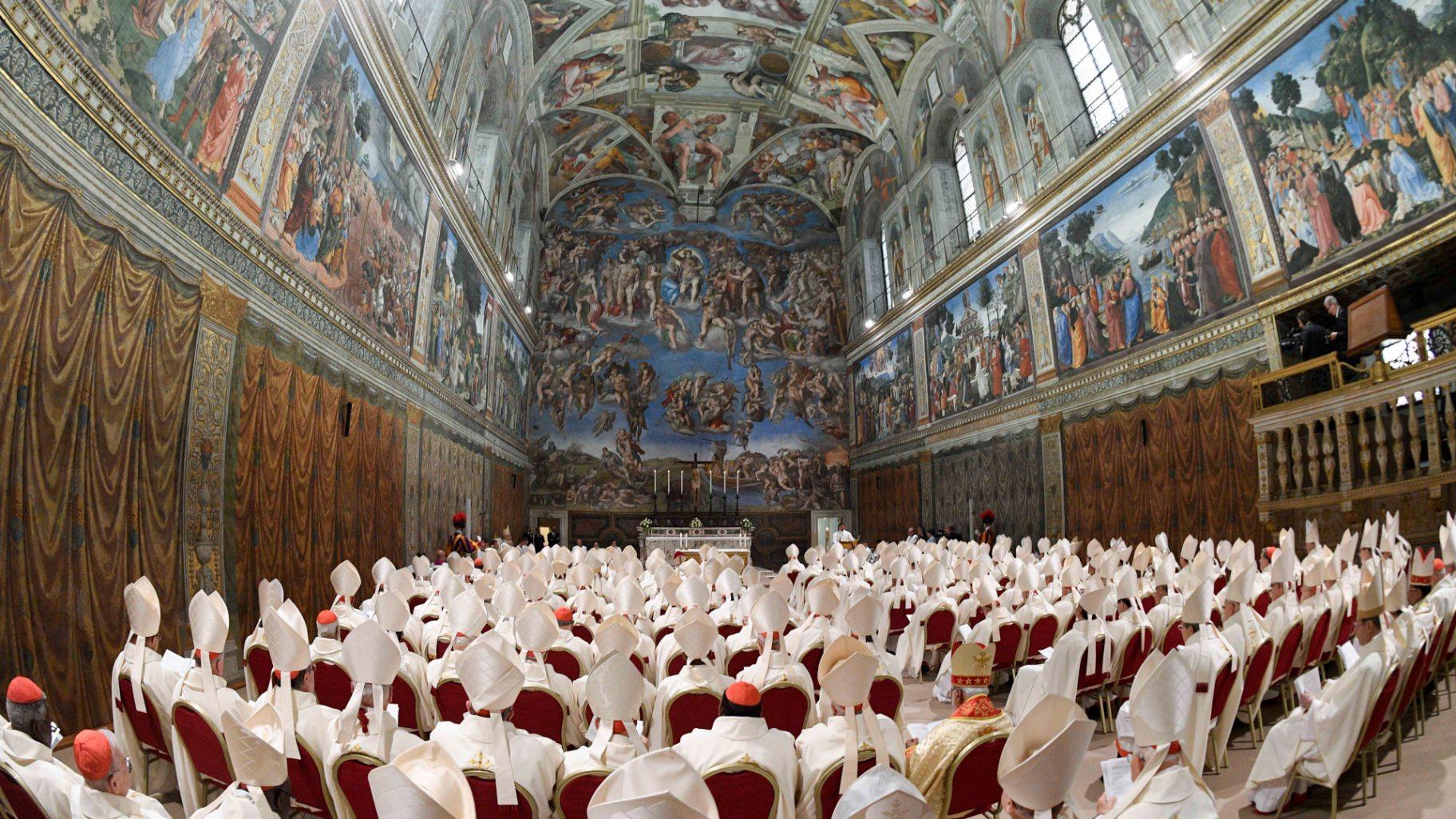Newly elected Pope Leo XIV, seated at the back left, concelebrates Mass with the College of Cardinals inside the Sistine Chapel at the Vatican the day after his election as 267th pontiff of the Roman Catholic Church, Friday, May 9, 2025. (Vatican Media via AP)