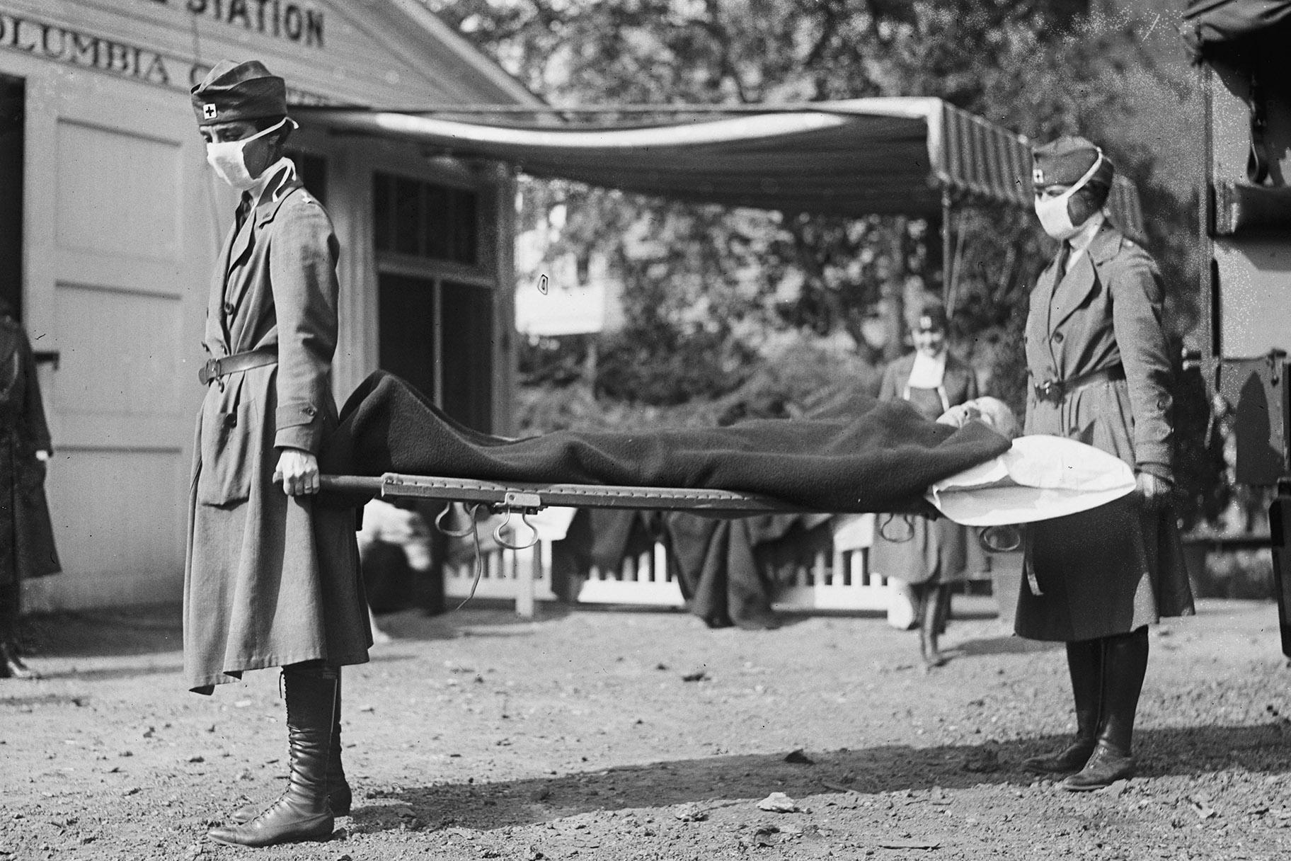 This photo made available by the Library of Congress shows a demonstration at the Red Cross Emergency Ambulance Station in Washington during the influenza pandemic of 1918. (Library of Congress via AP, File)
