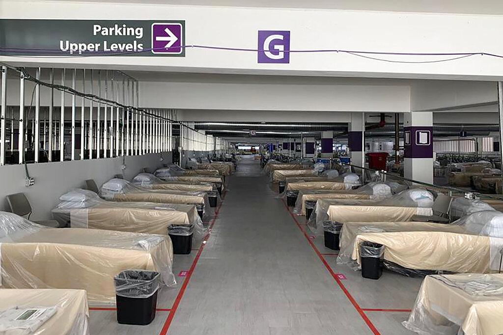 Hospital beds sit inside Renown Regional Medical Center’s parking garage, which has been transformed into an alternative care site for COVID-19 patients in Reno, Nev., on Wednesday, Nov. 11, 2020. (Lucia Starbuck / KUNR Public Radio / Report for America via AP)