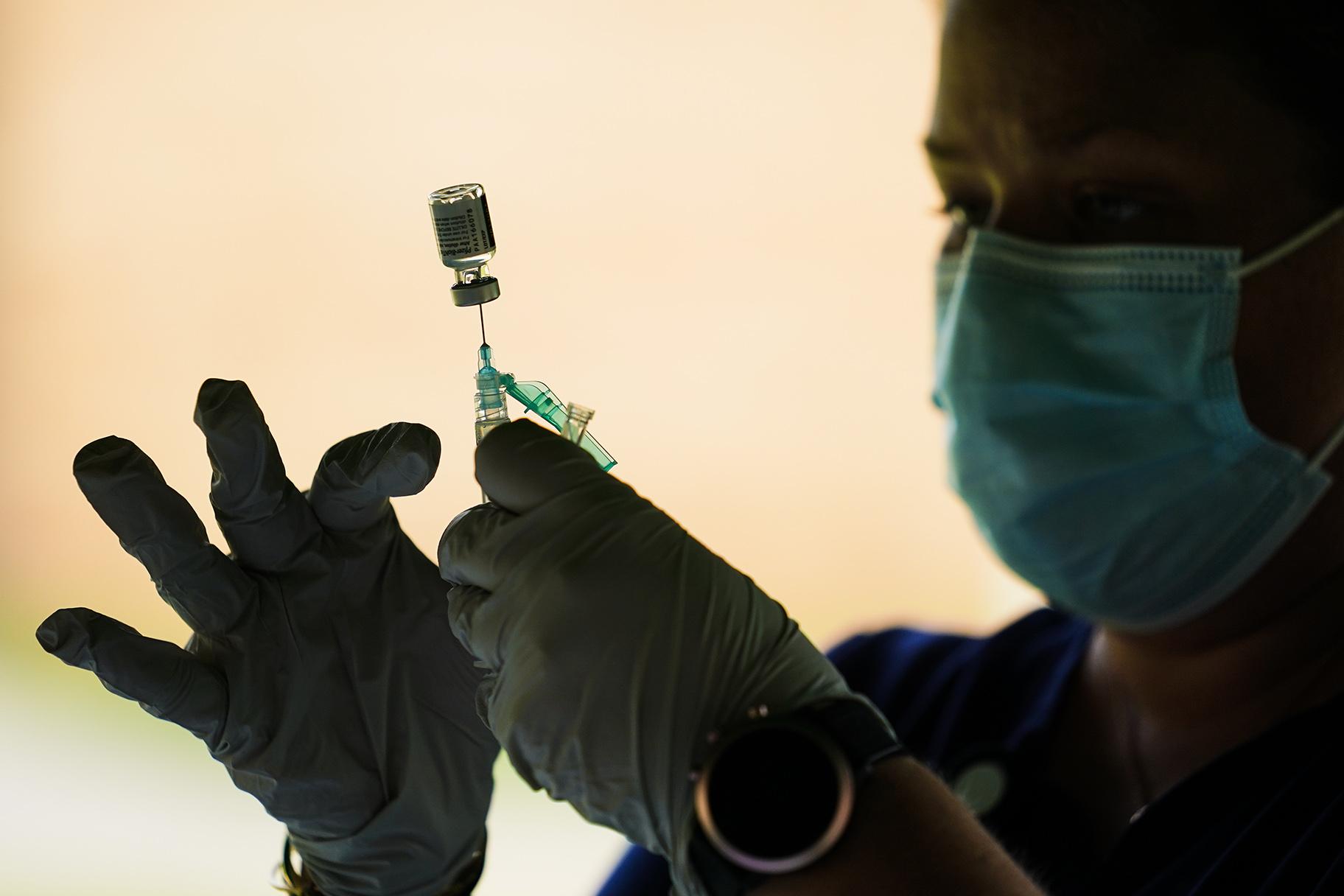 In this Sept. 14, 2021, file photo, a syringe is prepared with the Pfizer COVID-19 vaccine at a clinic at the Reading Area Community College in Reading, Pa. (AP Photo / Matt Rourke)