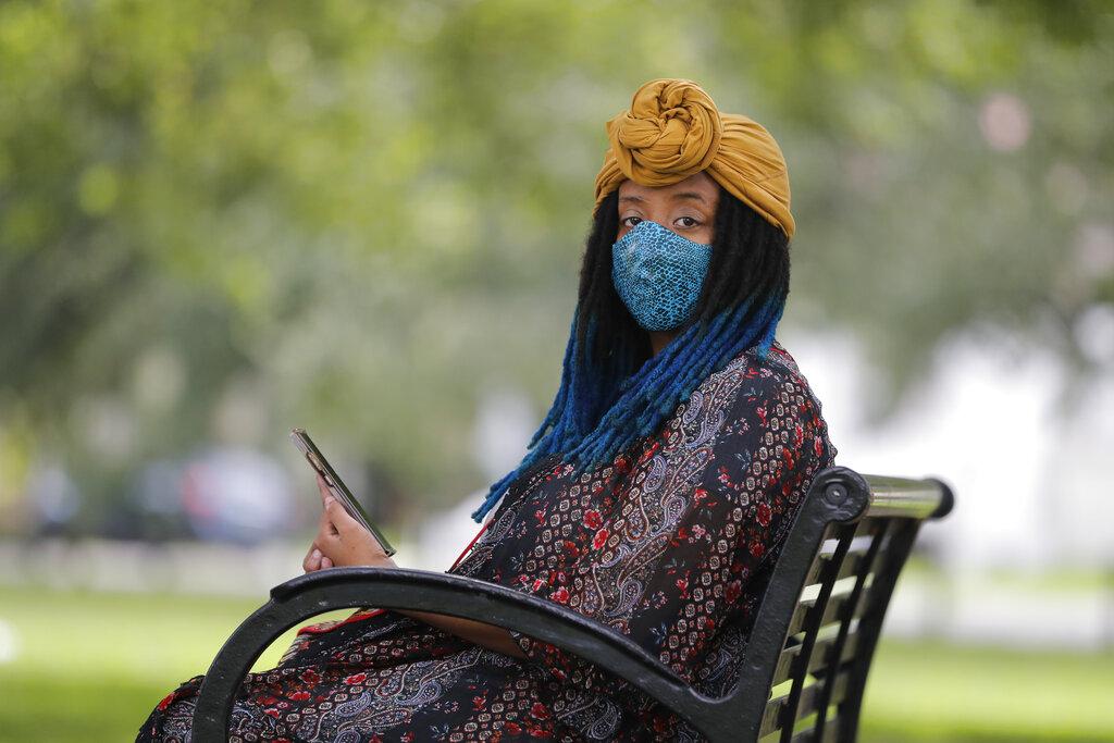 Jasmin Pierre poses for a photo with her smartphone app, in New Orleans, Thursday, July 2, 2020. (AP Photo / Gerald Herbert)