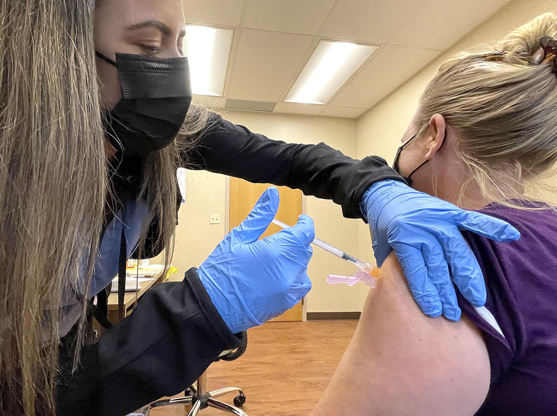 Nurse Jennifer Ulloa administers a COVID-19 vaccine Tuesday, July 27, 2021, at the county’s vaccination clinic in Whispering Pines, Calif. (Elias Funez / The Union via AP)
