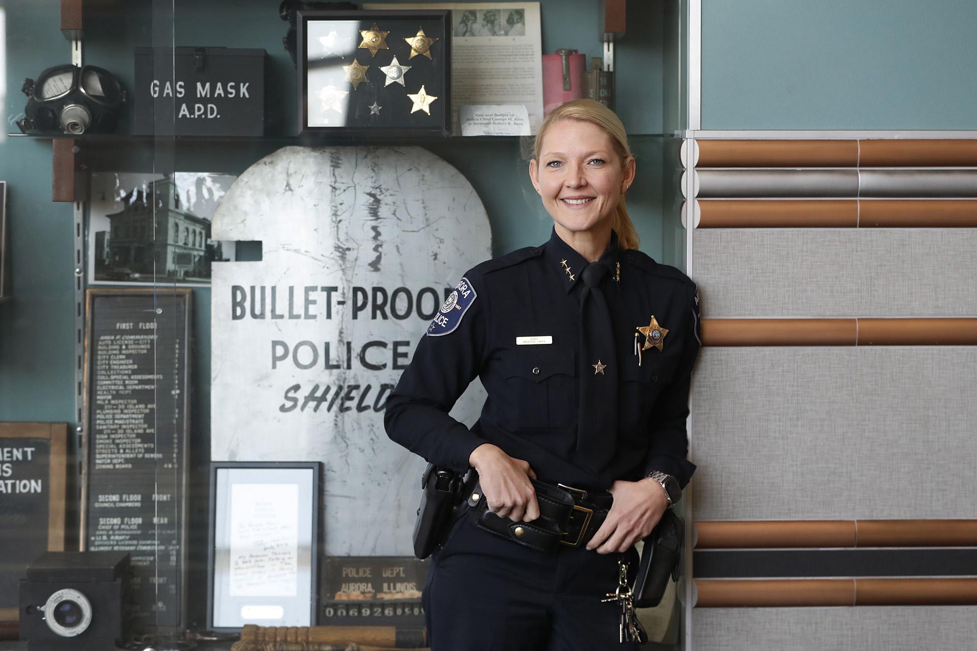 In this Monday, April 20, 2020, photo Aurora, Ill. police chief Kristen Ziman smiles as she poses for a portrait at police headquarters in Aurora. Across the country first responders who've fallen ill and recovered, like Chief Ziman, have begun the harrowing experience of returning to jobs that put them back on the front lines of America’s fight against the novel coronavirus. (AP Photo / Charles Rex Arbogast)